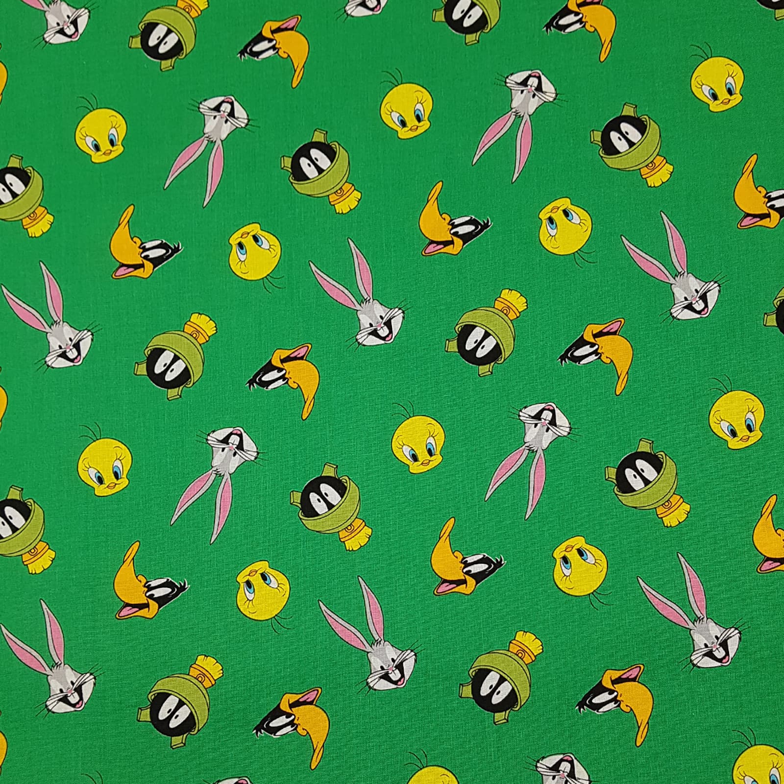 Camelot® Fabrics Looney Tunes™ Green Faces Toss Cotton Fabric