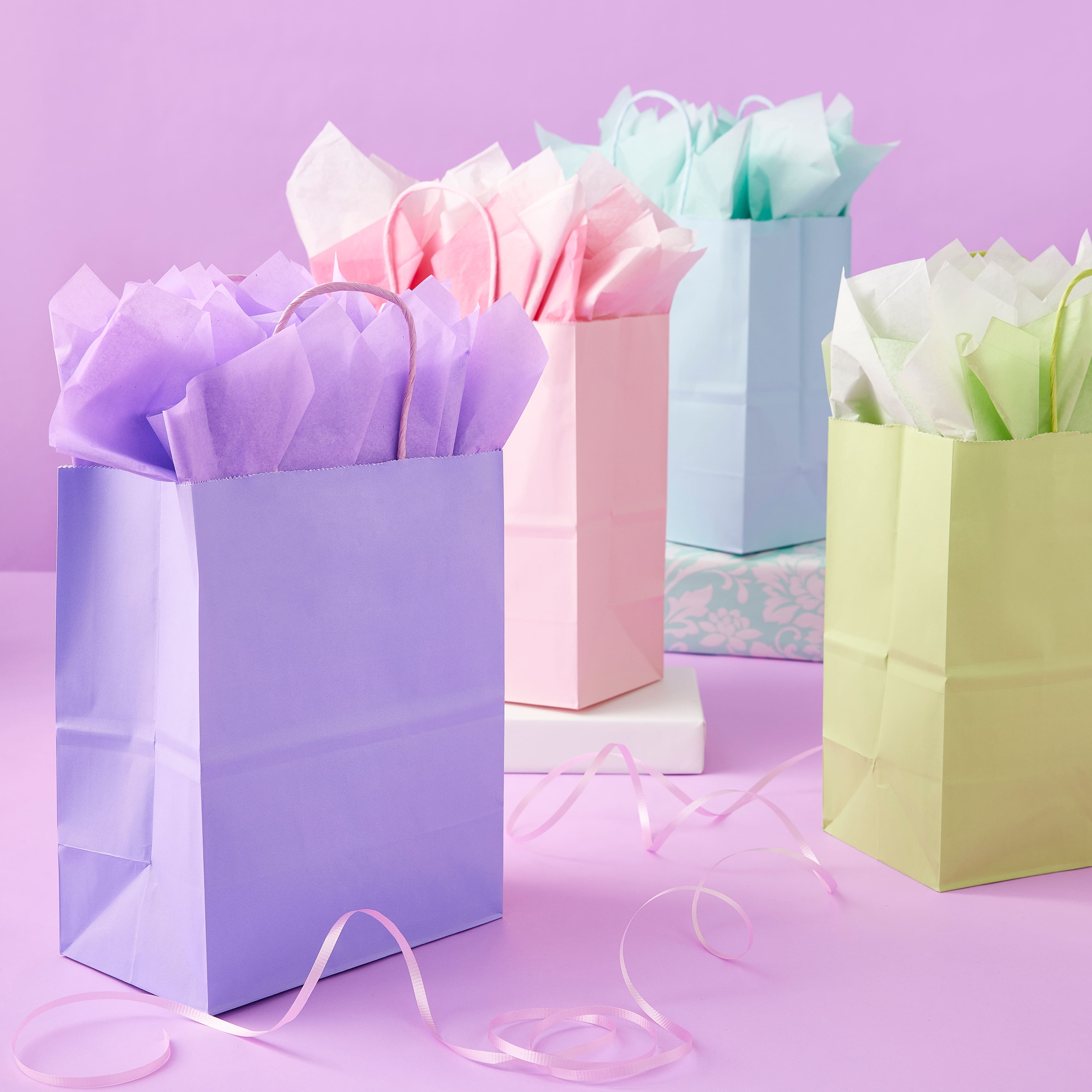 10 Packs: 13 ct. (130 total) Medium Pastel Gifting Bags by Celebrate It&#x2122;