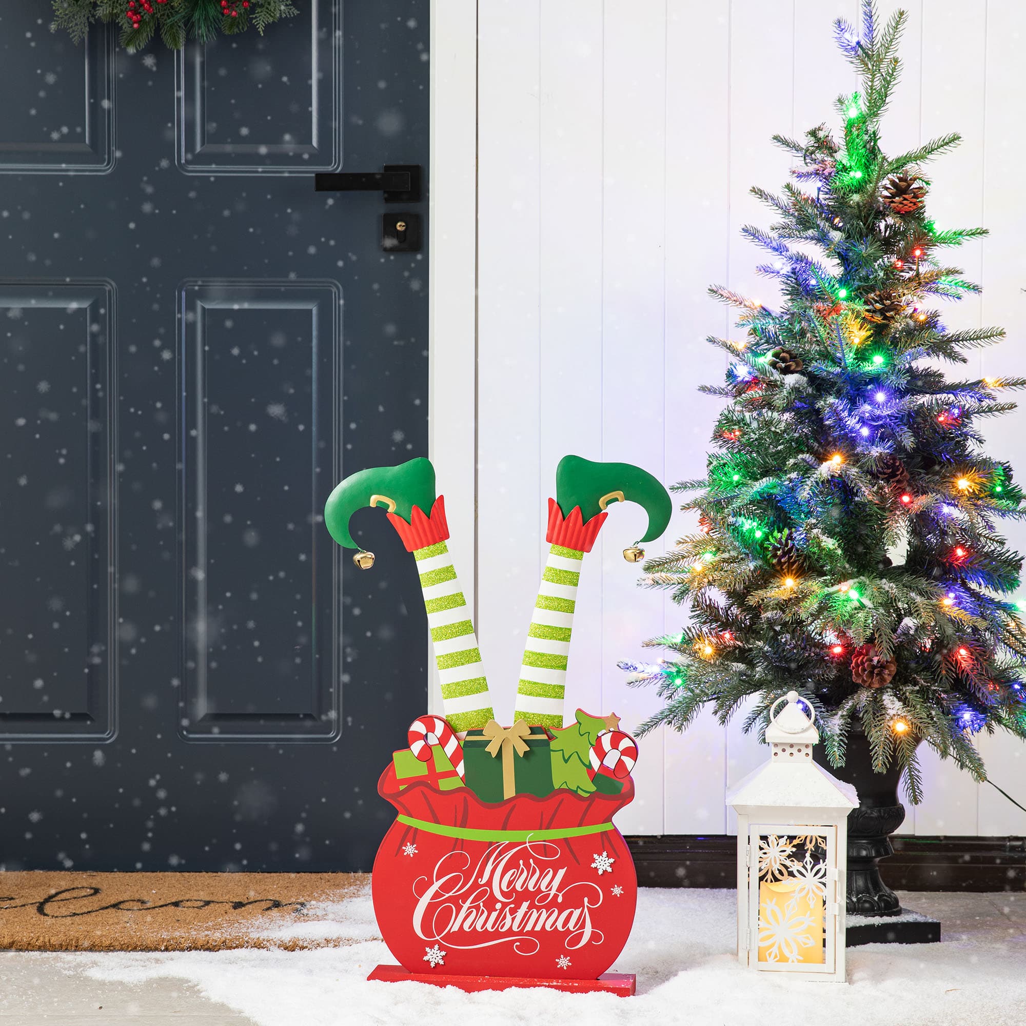Glitzhome® 2ft. Wood & Metal Elf Legs in Gift Box Porch Décor