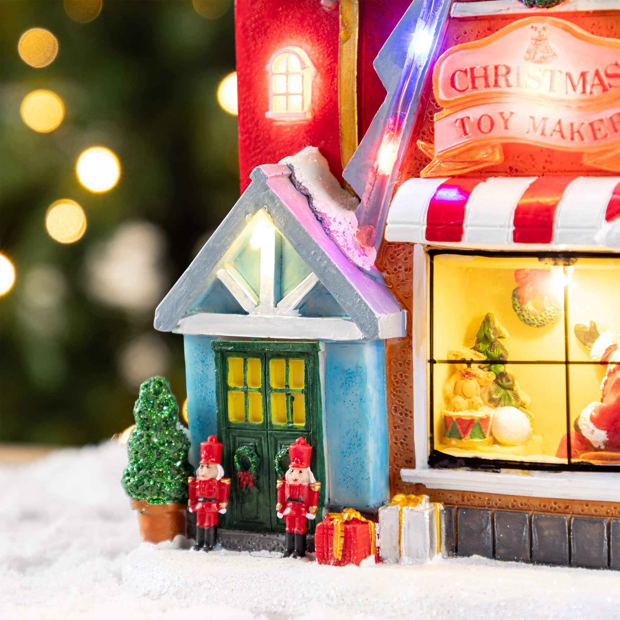 Glitzhome&#xAE; 10.75&#x22; Lighted CHRISTMAS TOY MARKET Resin Village with Movement and Music