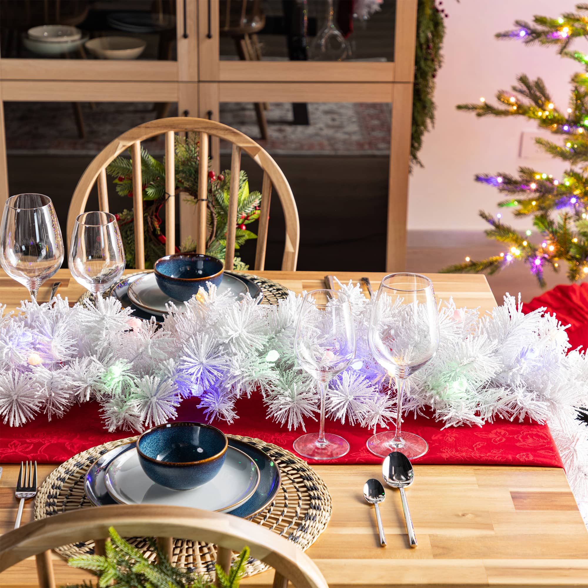Glitzhome&#xAE; 9ft Pre-Lit Snow Flocked White Pine Christmas Garland with Timer