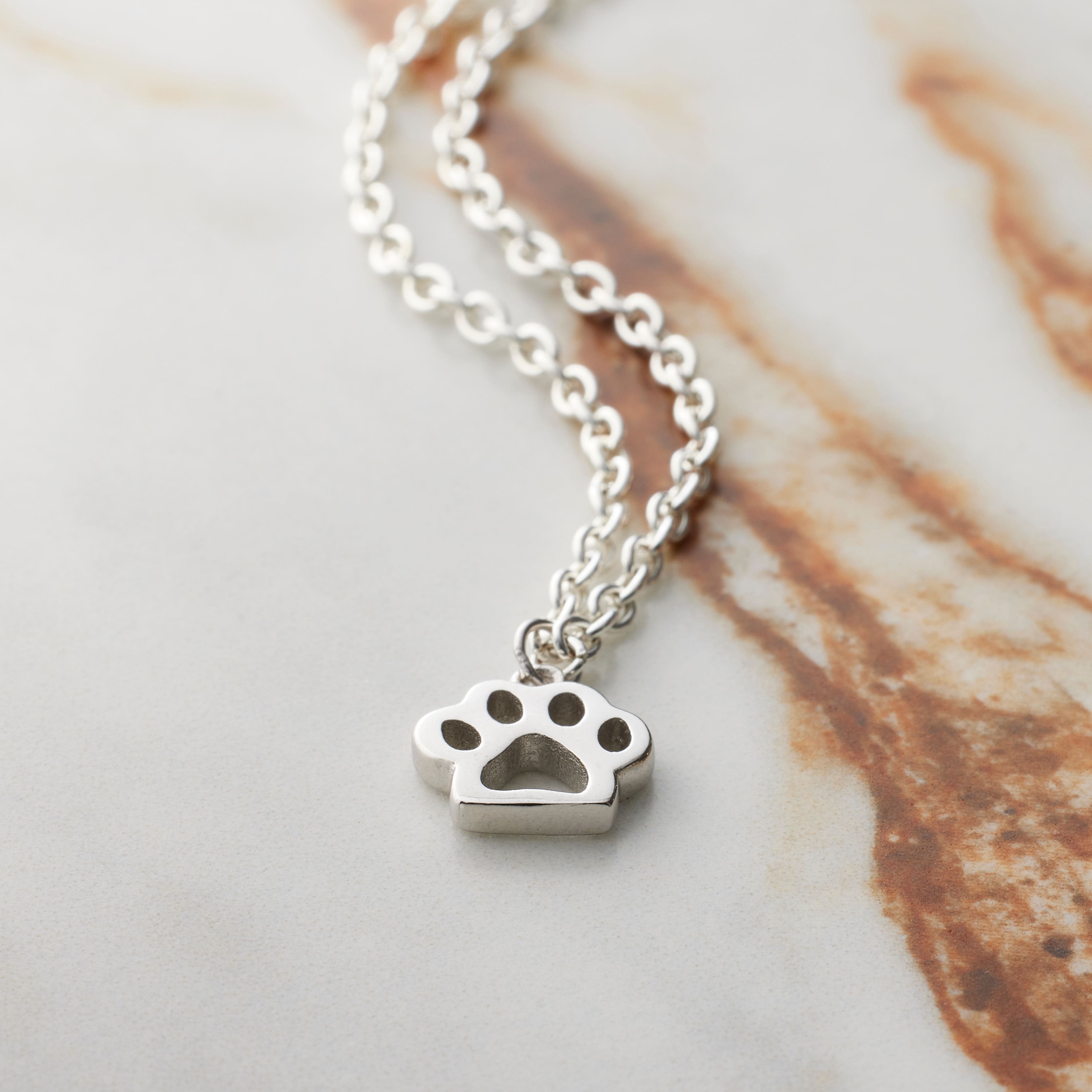 12 Pack: Sterling Silver Paw Icon Charm by Bead Landing™
