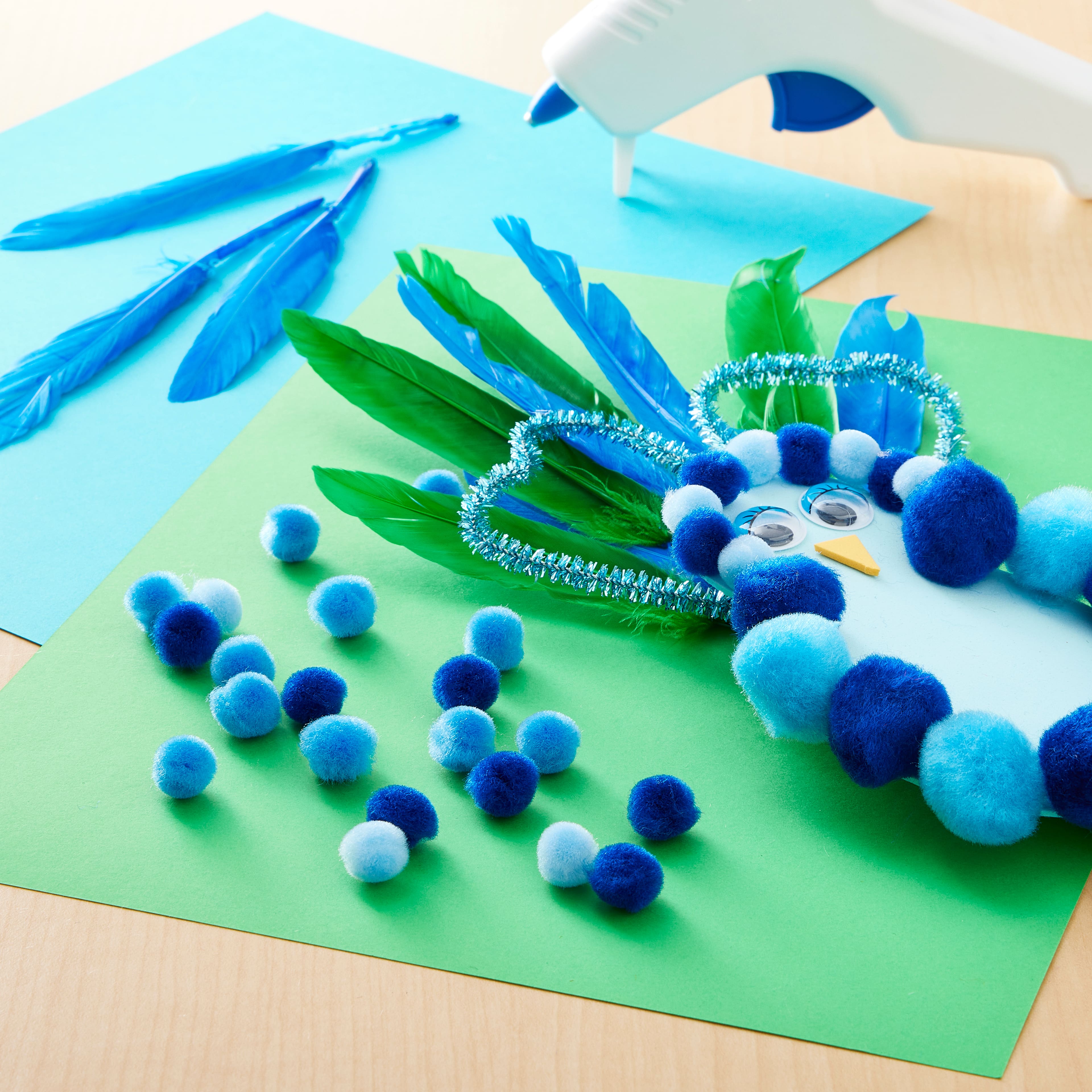 24 Packs: 100 ct. (2,400 total) 1/2&#x22; Mixed Blue Pom Poms by Creatology&#x2122;