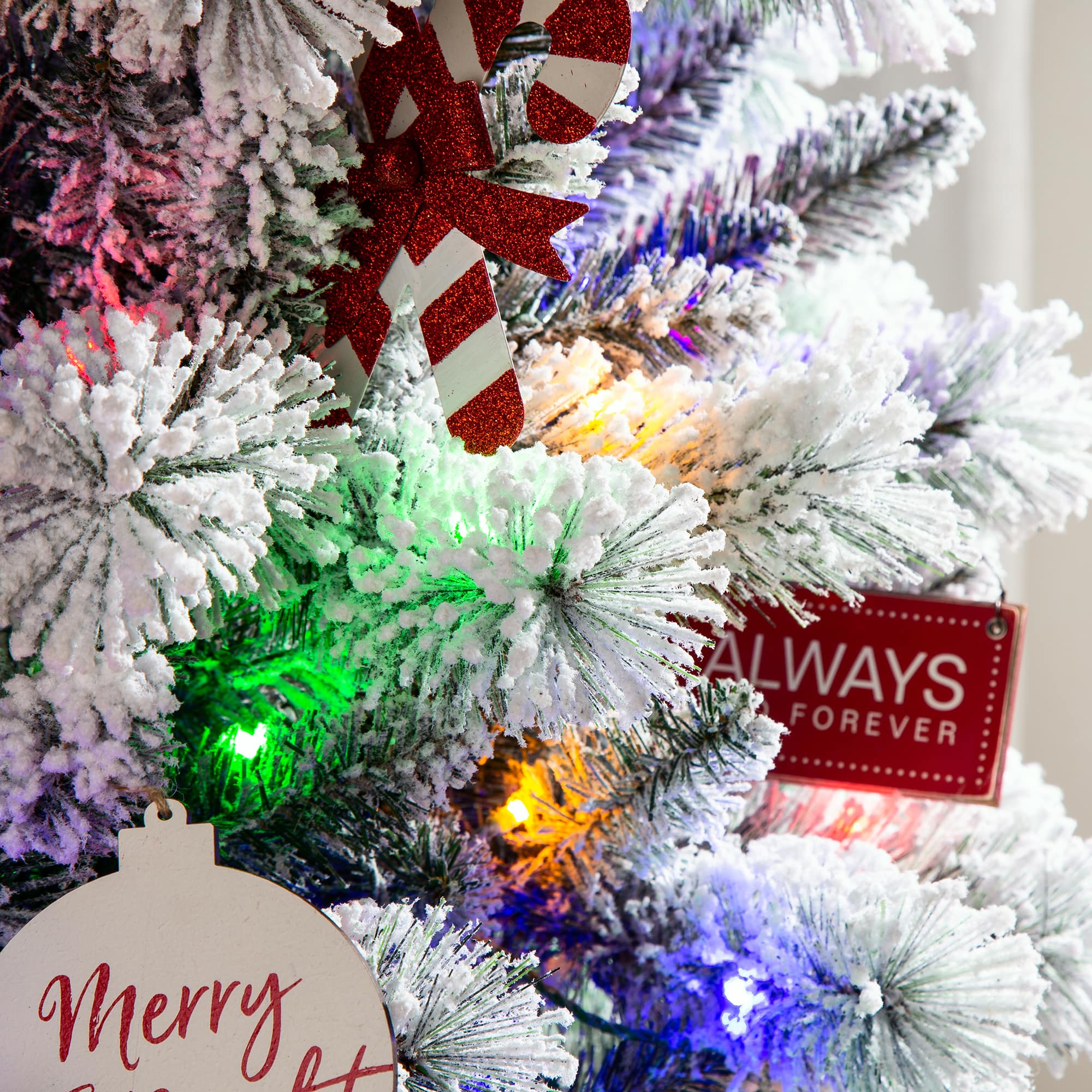 9ft. Pre-Lit Flocked Pine Pencil Artificial Christmas Tree, Multicolor LED Lights