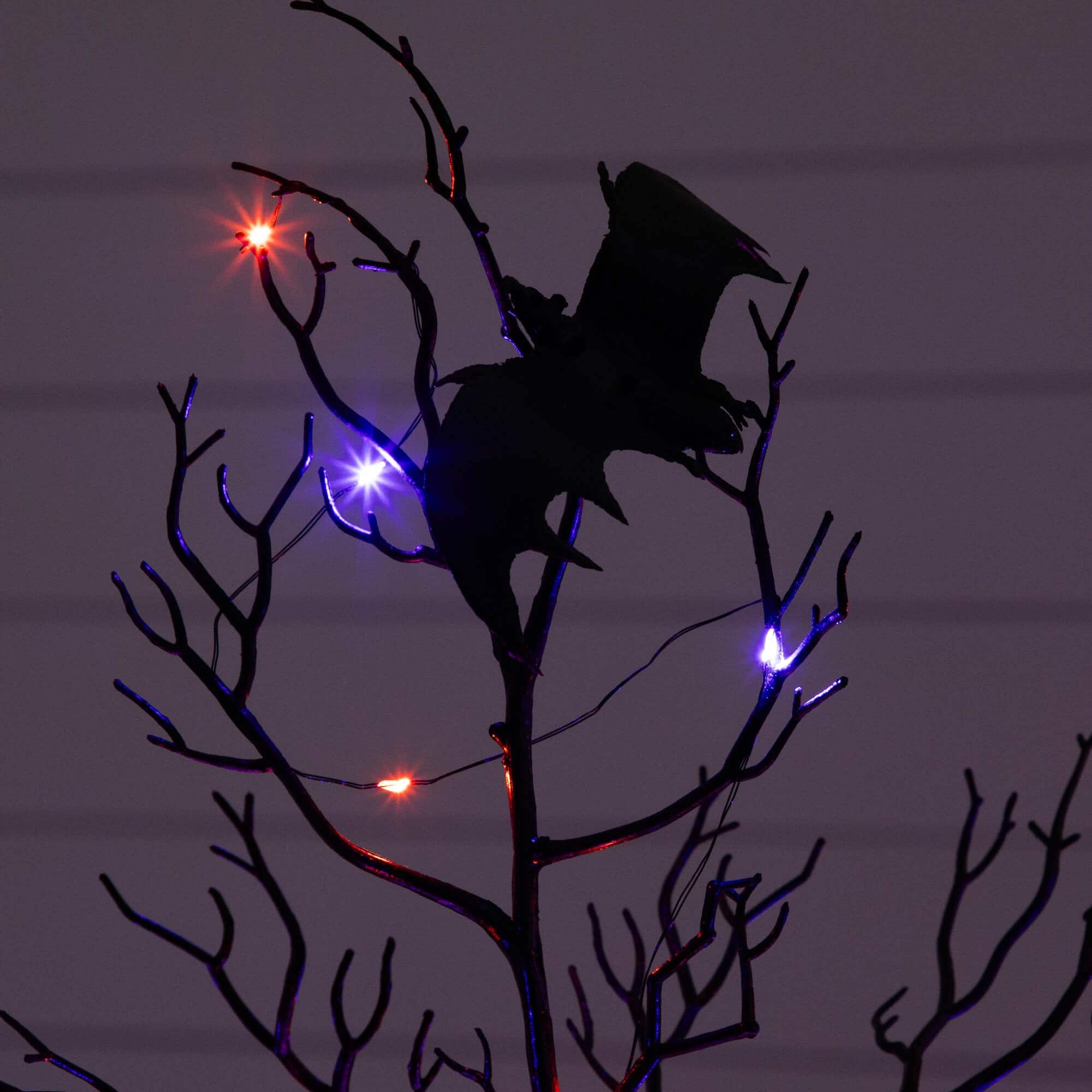 4ft. Pre-Lit Artificial Halloween Black Spooky Twig Tree with Bats and 120 Orange &#x26; Purple LED Lights