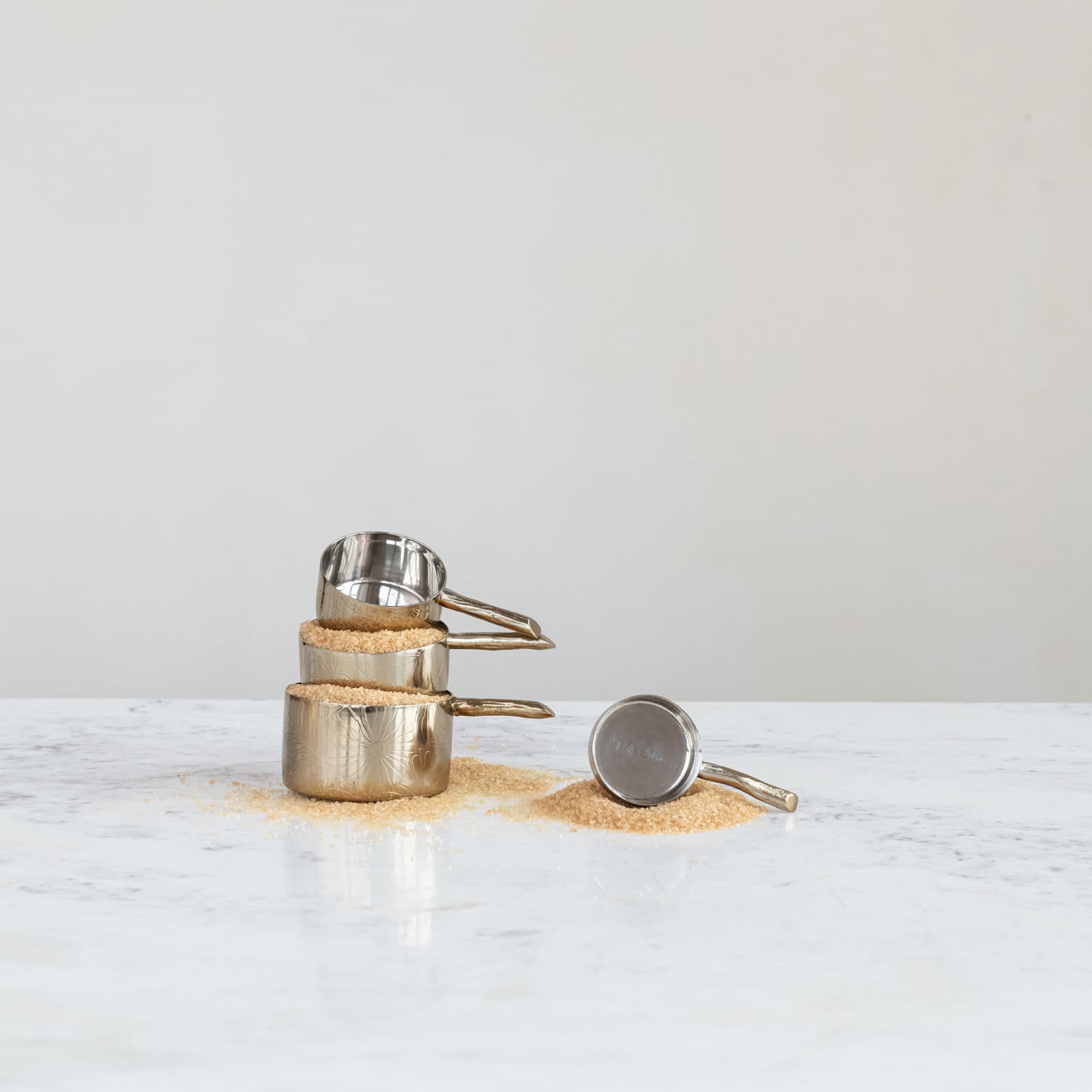 Hello Honey® Brass 4-Piece Stainless Steel Measuring Cup Set with Etched Flowers & Twig Shaped Handles