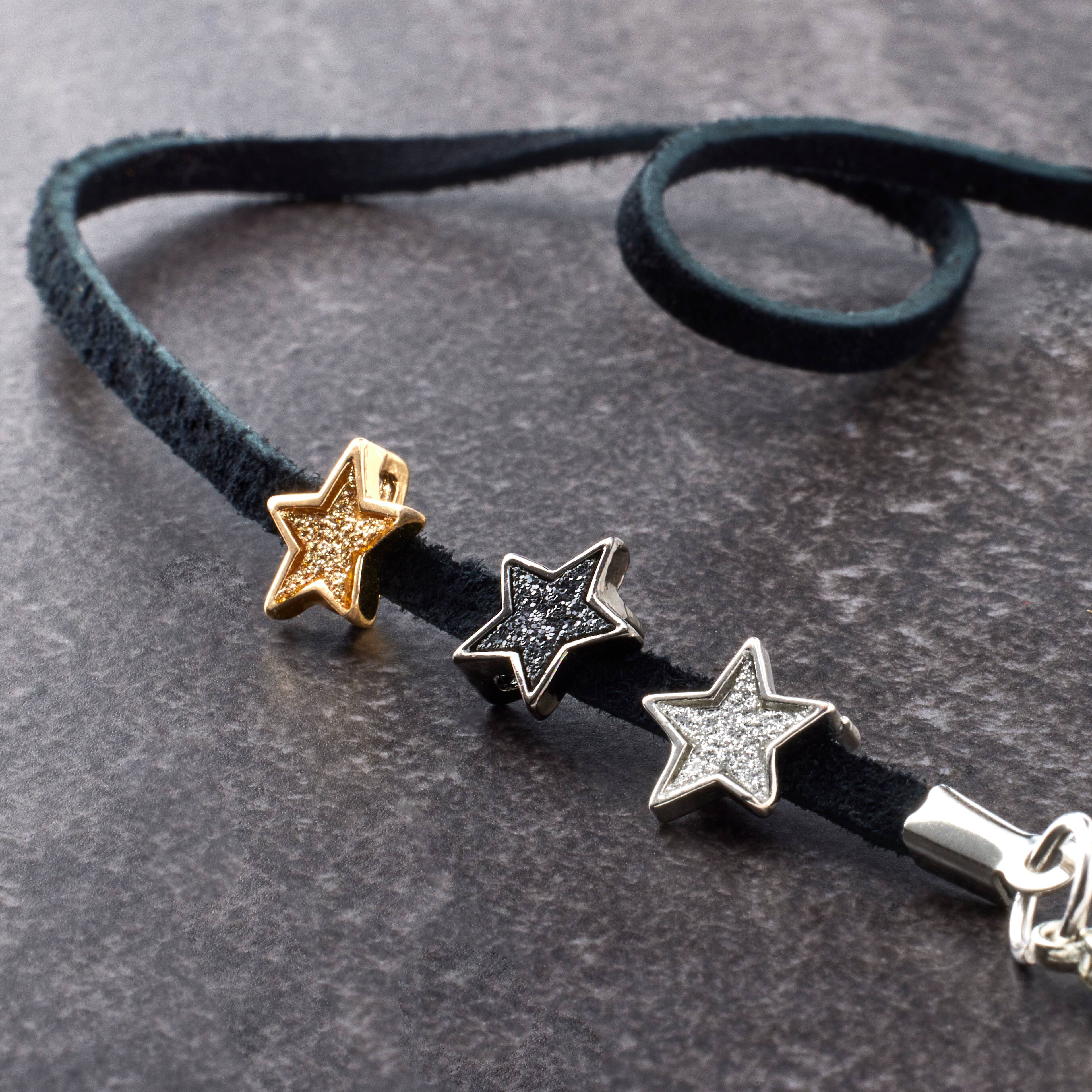 Shimmery gray resin star with gold center