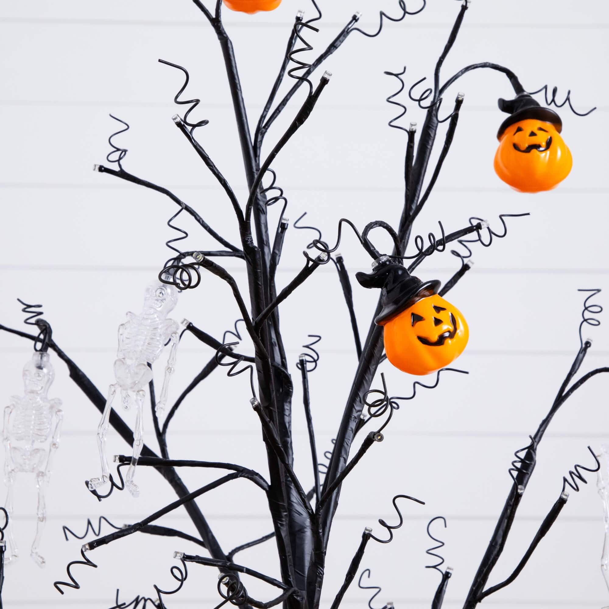 4ft. Pre-Lit Artificial Halloween Pumpkins and Skulls Ornament Tree with 64 Warm White LED Lights