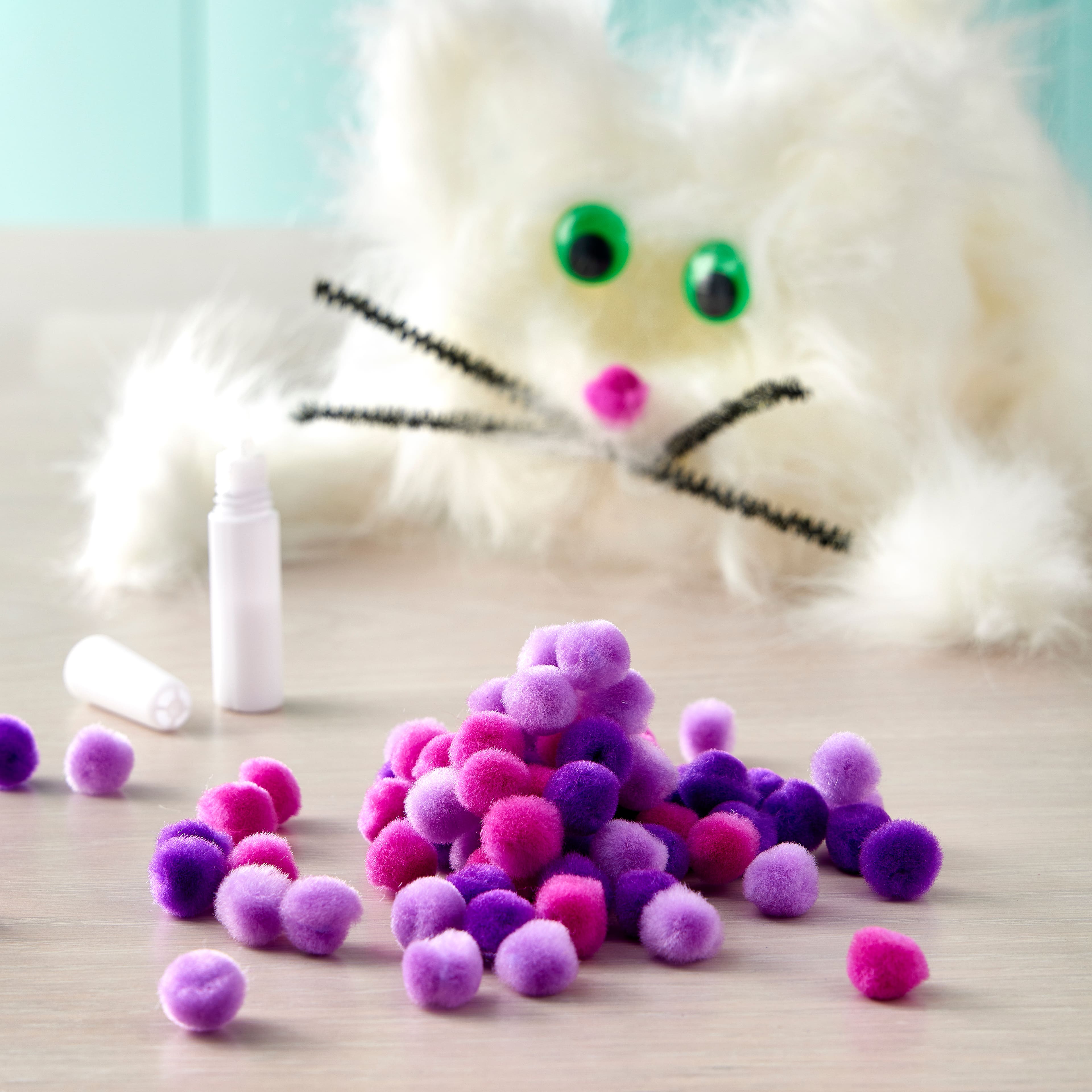 24 Packs: 100 ct. (2,400 total) 1/2" Mixed Purple Pom Poms By Creatology™