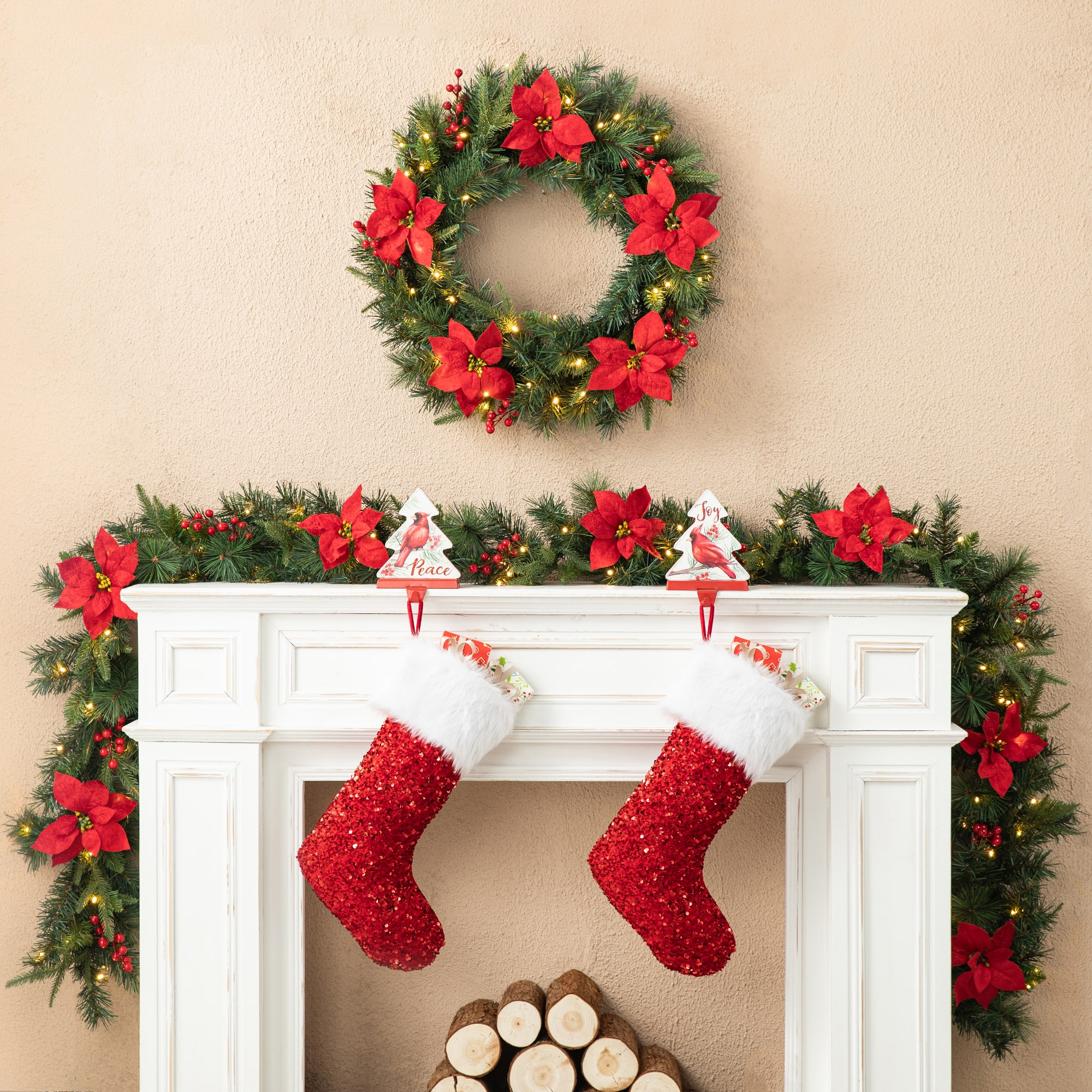 Glitzhome&#xAE; 9ft. Pre-Lit Greenery Pine Poinsettia and Berries Christmas Garland with LED Lights and Timer