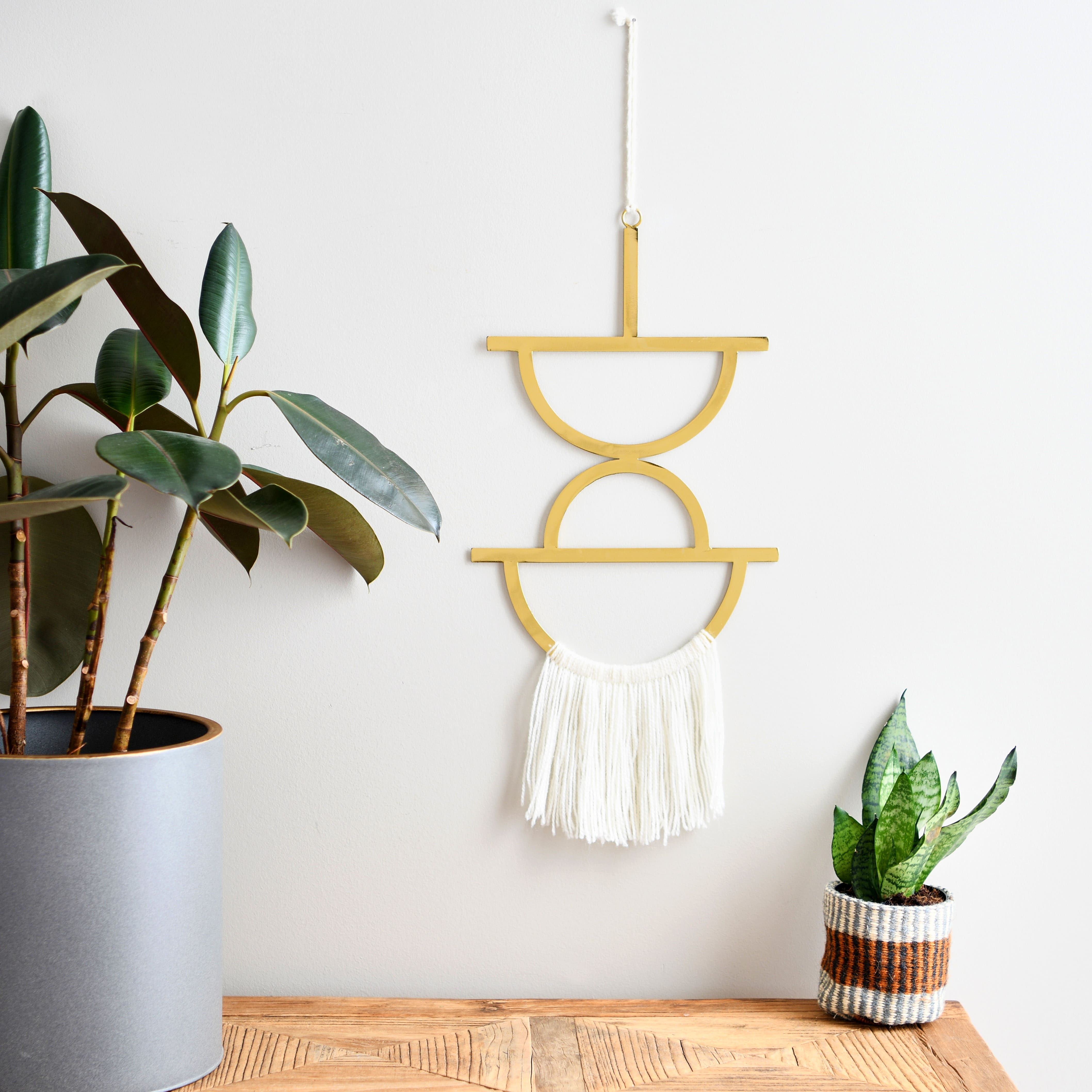 Hello Honey&#xAE; Gold Geometric Metal Wall Hanging with Tassel