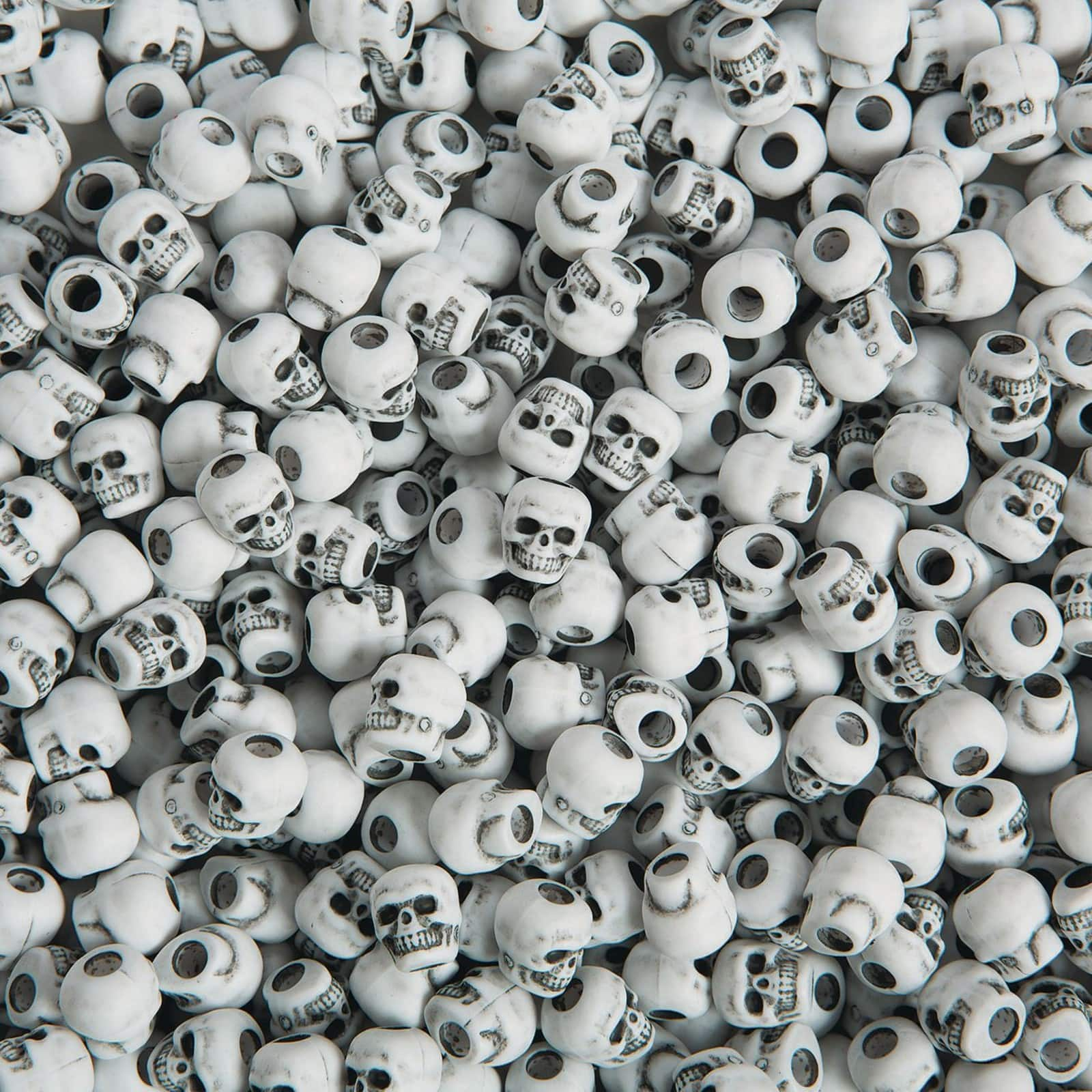 The Beadery&#xAE; White Plastic Skull Pony Beads, 10mm