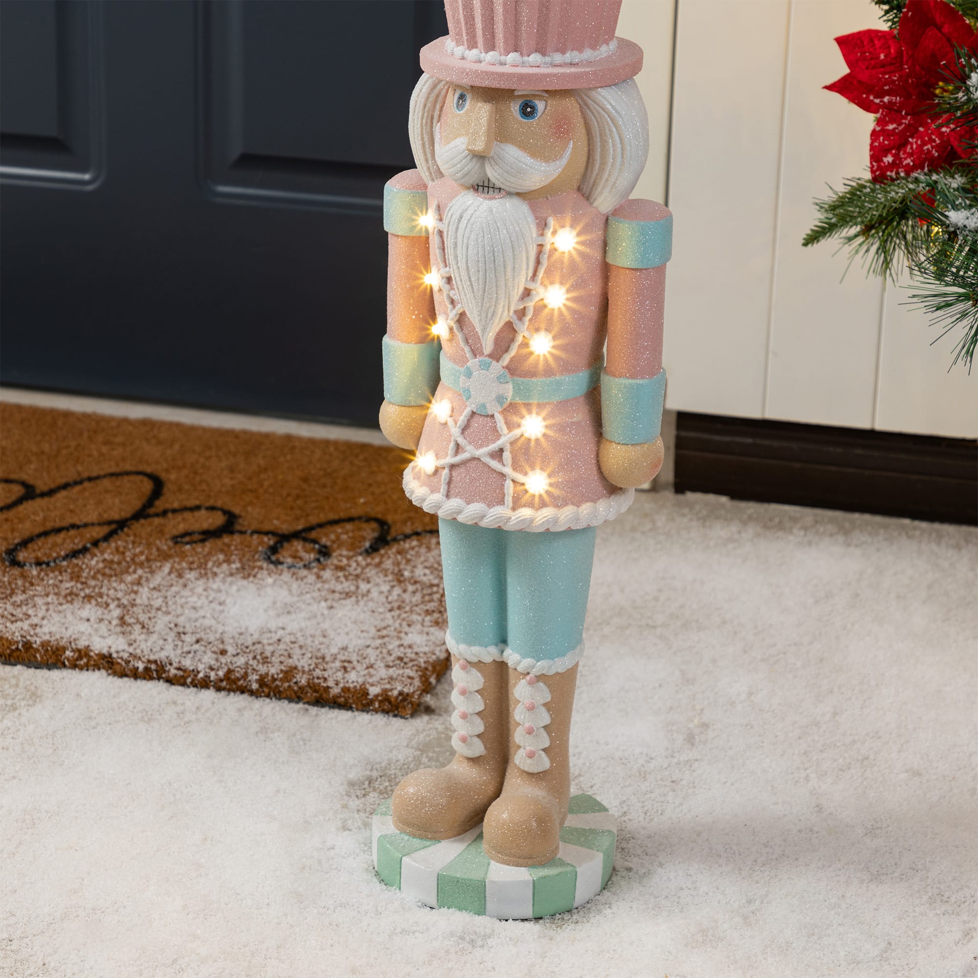 Glitzhome&#xAE; 28&#x22; Lighted Resin Christmas Cupcake Nutcracker Porch Decor with Timer