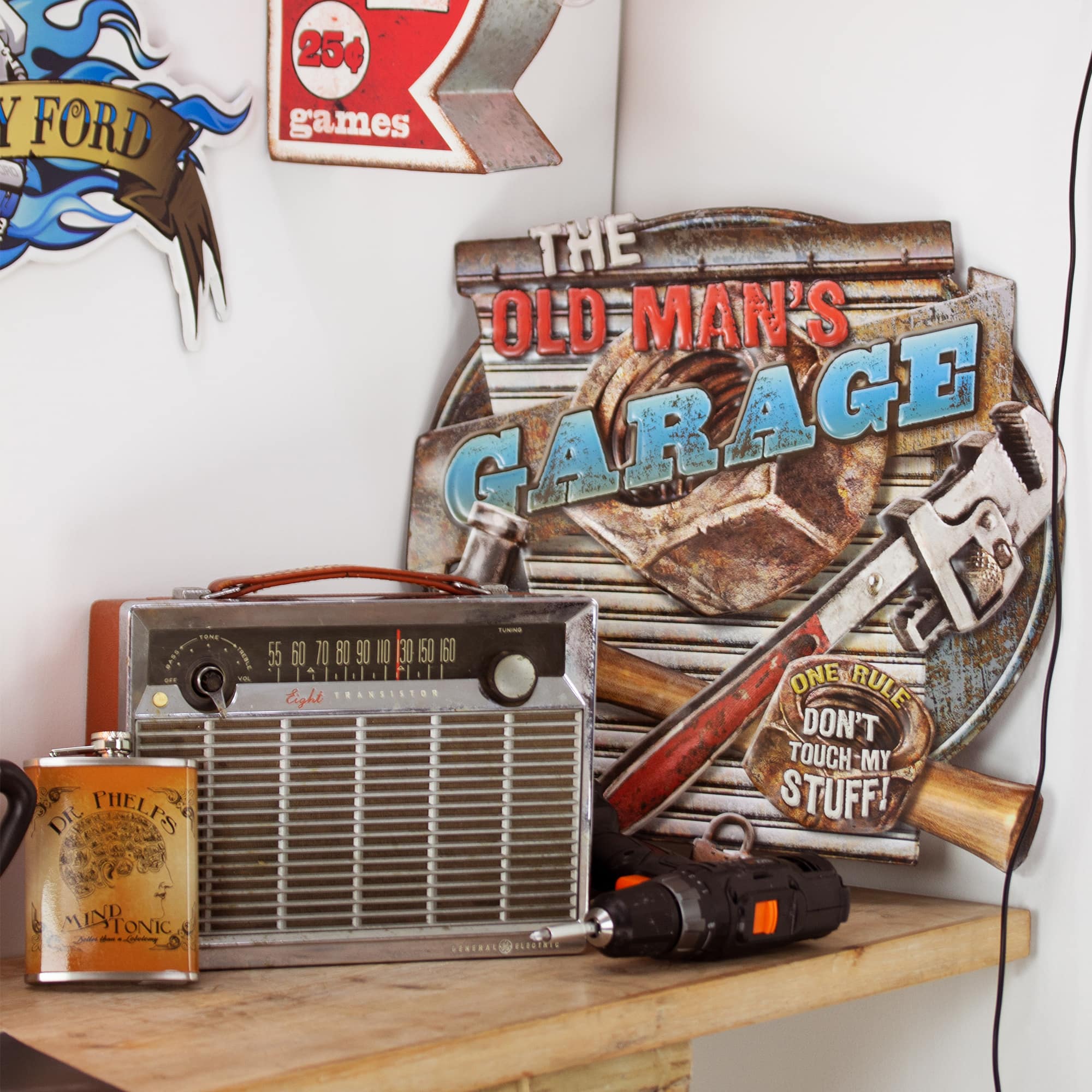 American Art Décor™ 16.5" The Old Man's Garage Embossed Metal Sign