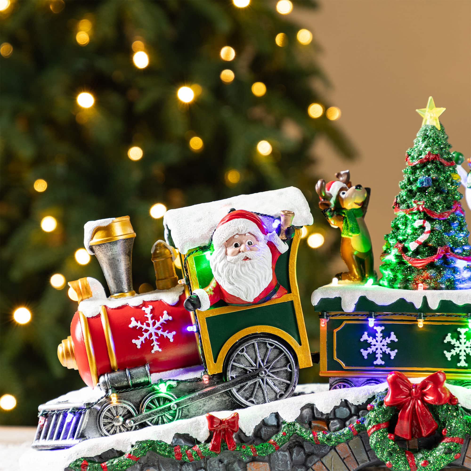 Glitzhome&#xAE; 20&#x22; Lighted Christmas Santa Train Resin Village with Movement and Music