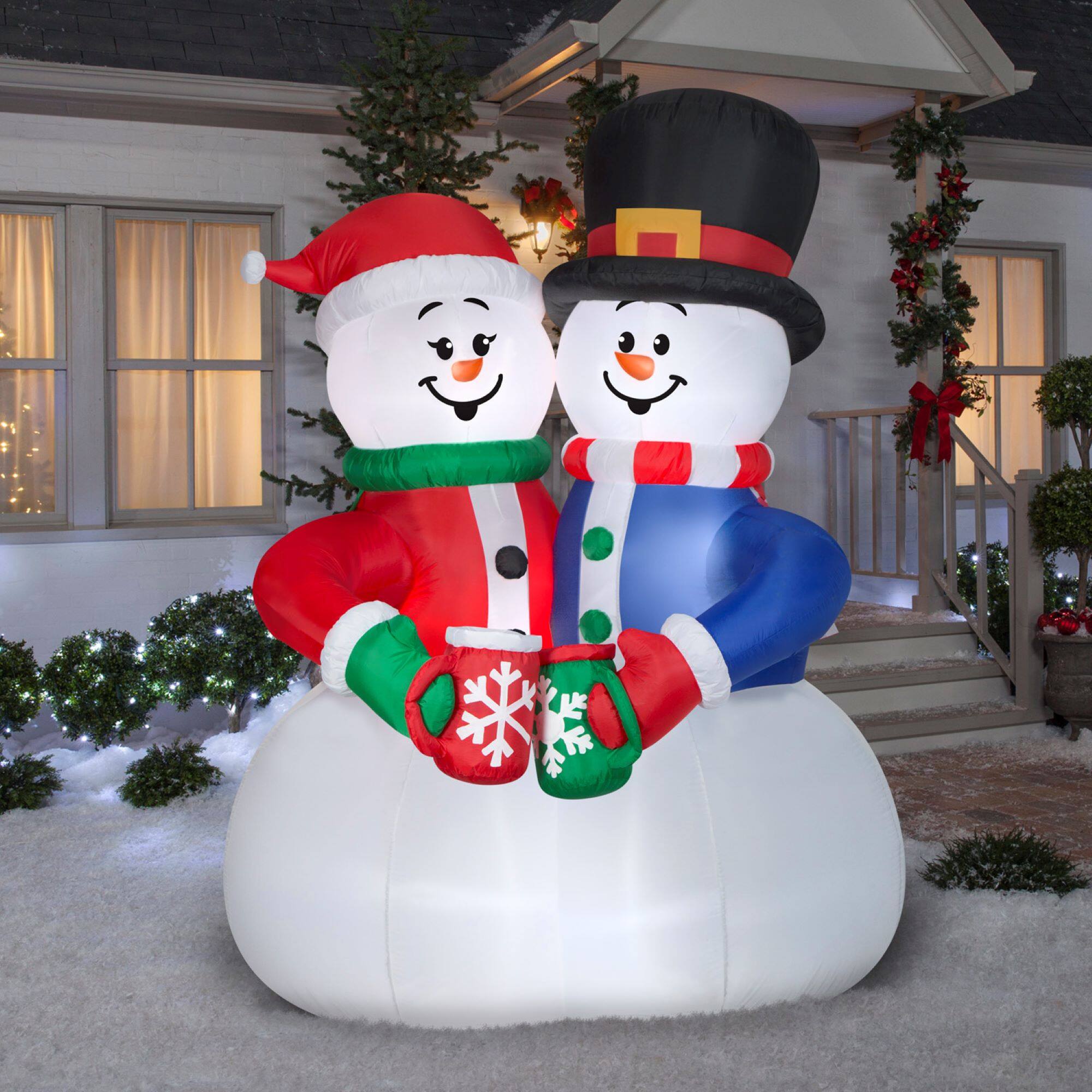 8ft. Animated Airblown&#xAE; Inflatable Christmas Snow Couple Cocoa Cheers Scene