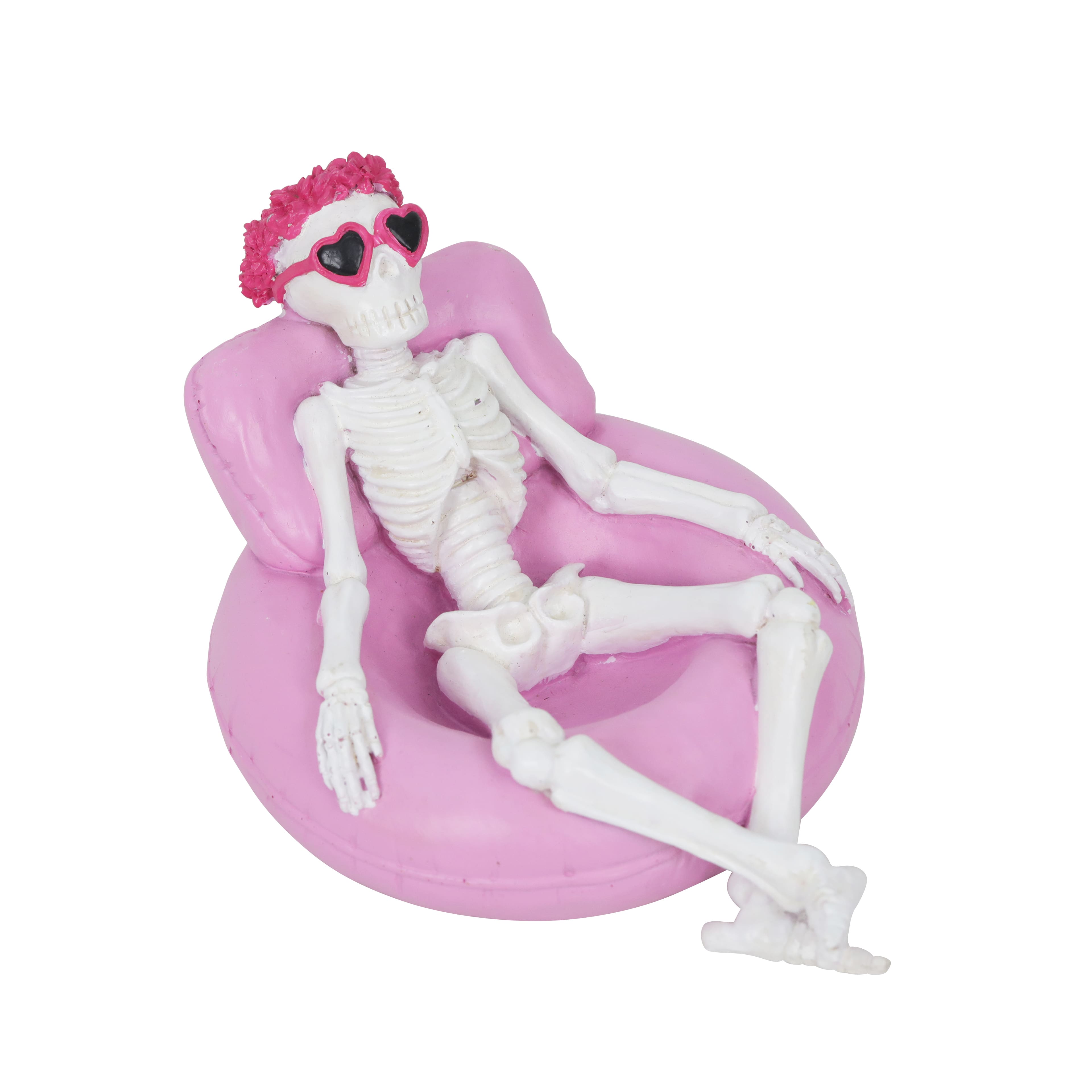 7.25&#x22; Skeleton on a Pink Pool Float Tabletop D&#xE9;cor by Ashland&#xAE;