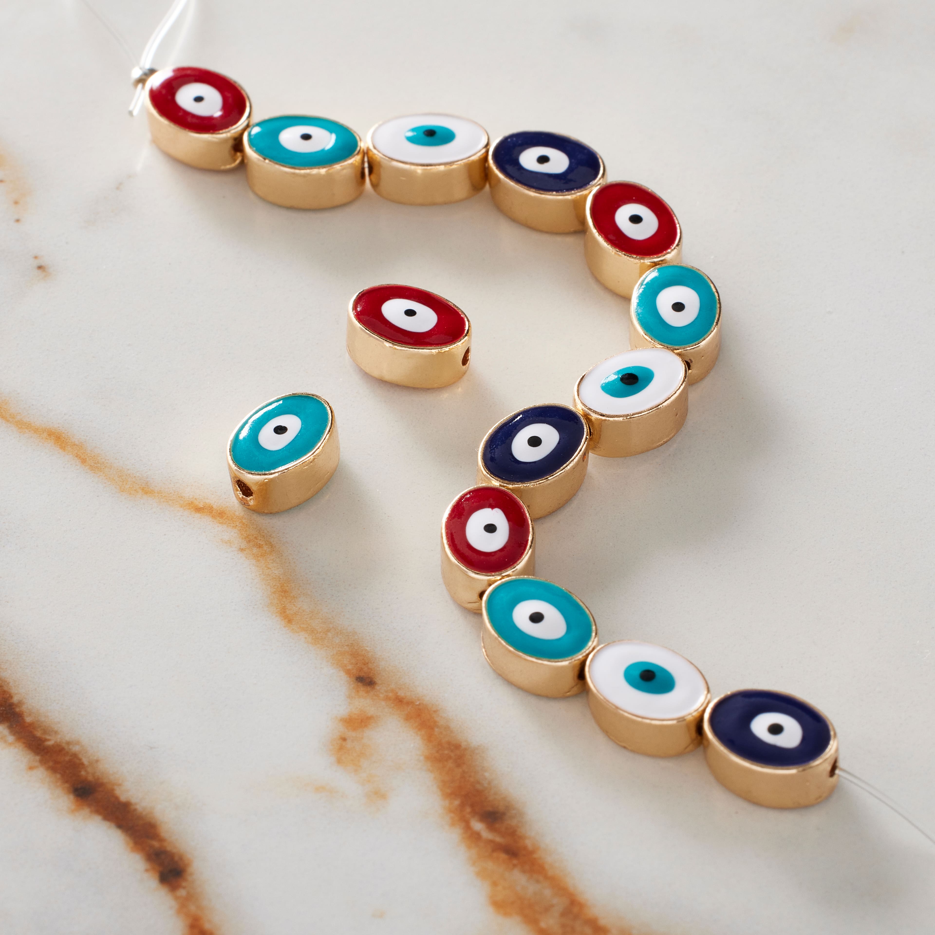 Multicolor &#x26; Gold Evil Eye Oval Beads, 9mm by Bead Landing&#x2122;