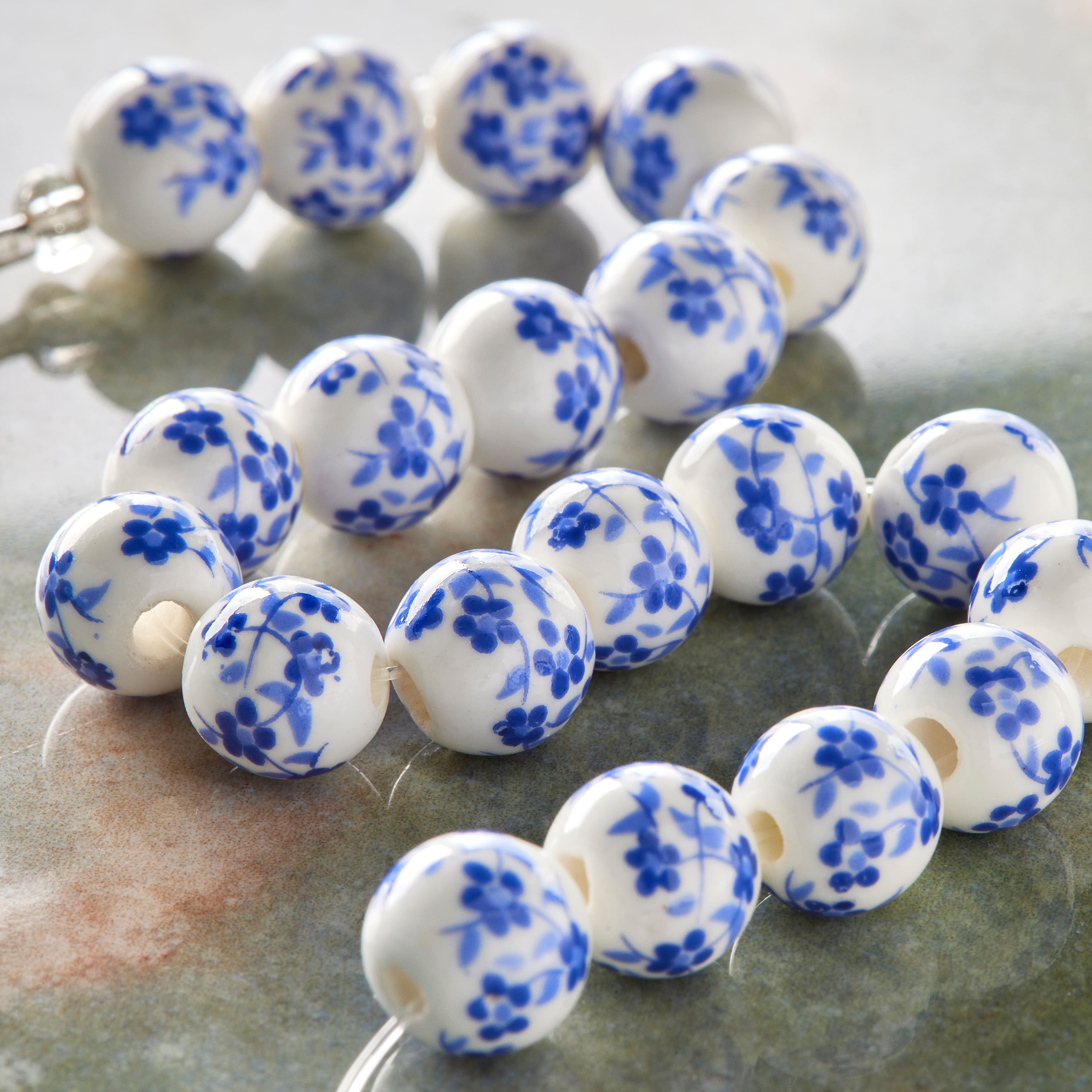 12 Pack: Blue Daisy Ceramic Round Beads, 8mm by Bead Landing&#x2122;