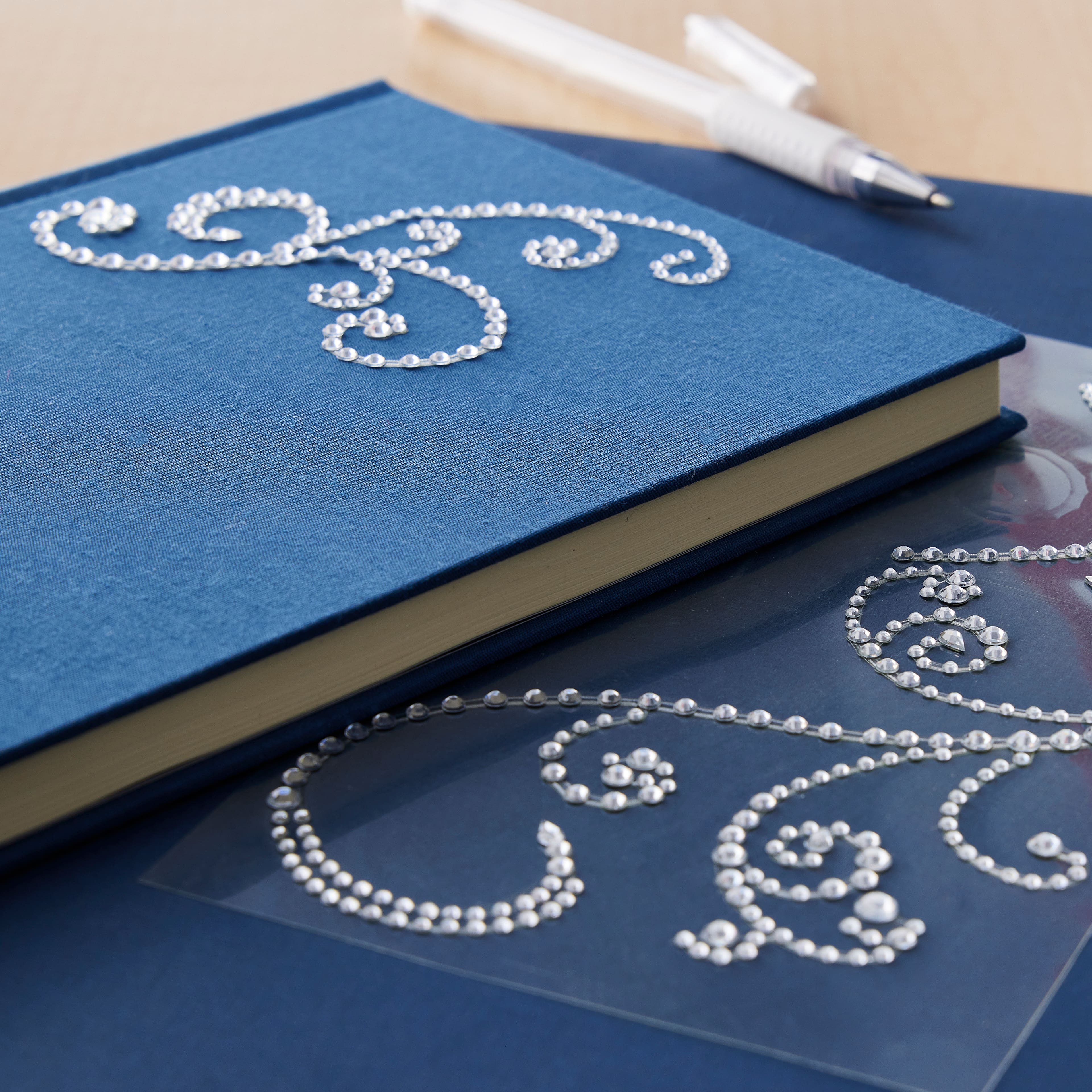 12 Packs: 3 ct. (36 total) Large Clear Flourish Adhesive Rhinestones by Recollections™