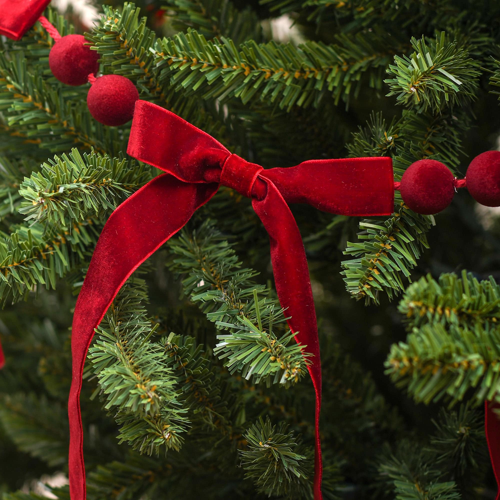 6ft. Dark Red Flocked Bead &#x26; Bow Garland by Ashland&#xAE;