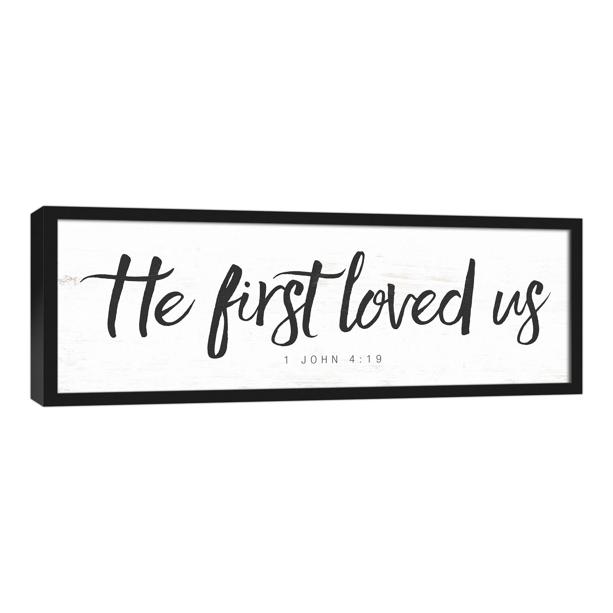 He First Loved Us 37.73&#x22; x 13.73&#x22; Black Framed Canvas