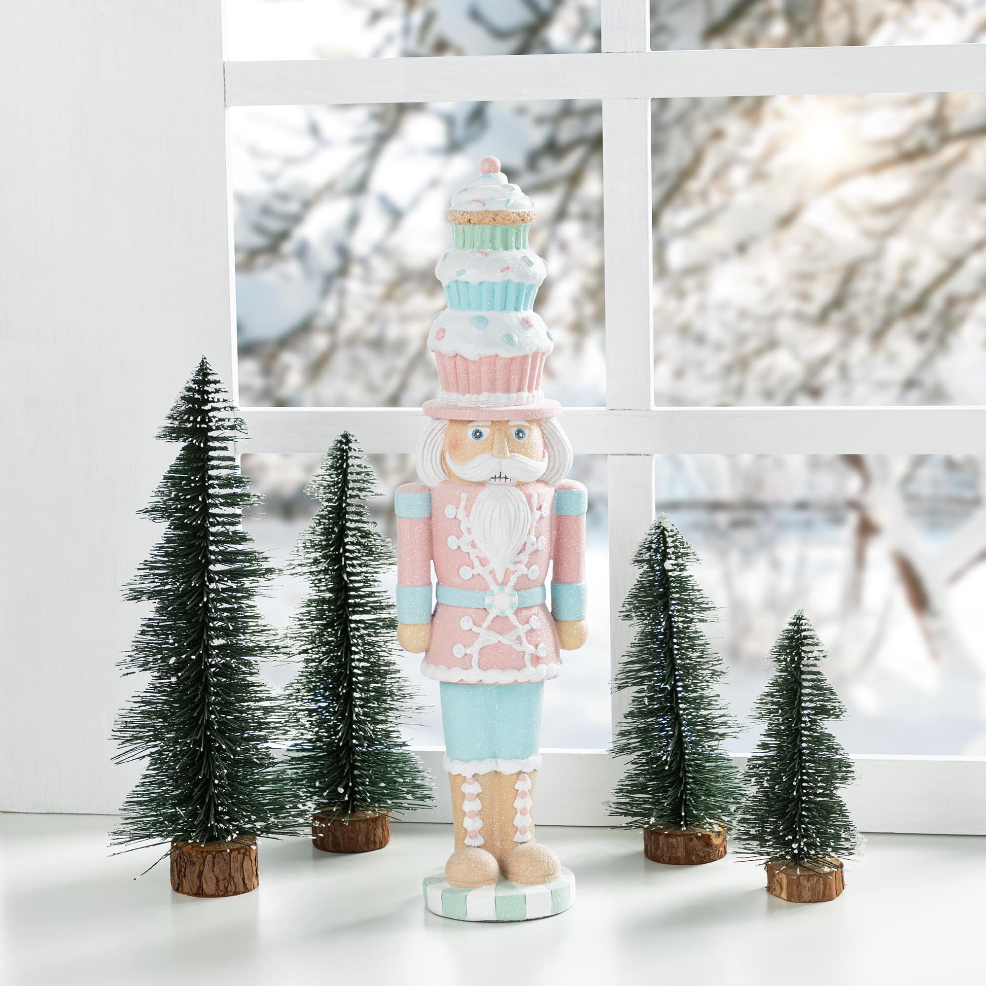 Glitzhome&#xAE; 18.25&#x22; Resin Christmas Cupcake Nutcracker Table Decor