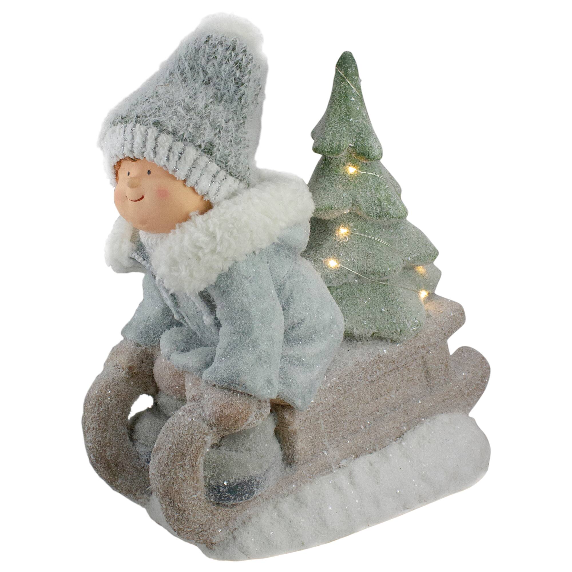 15&#x22; Beige &#x26; Green Lighted Boy on a Sled Christmas Decoration