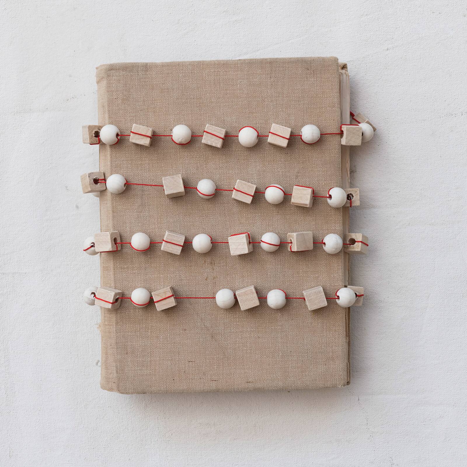 Hello Honey&#xAE; 6ft. Paulownia Wood Mixed Shapes Beads &#x26; Red String Garland