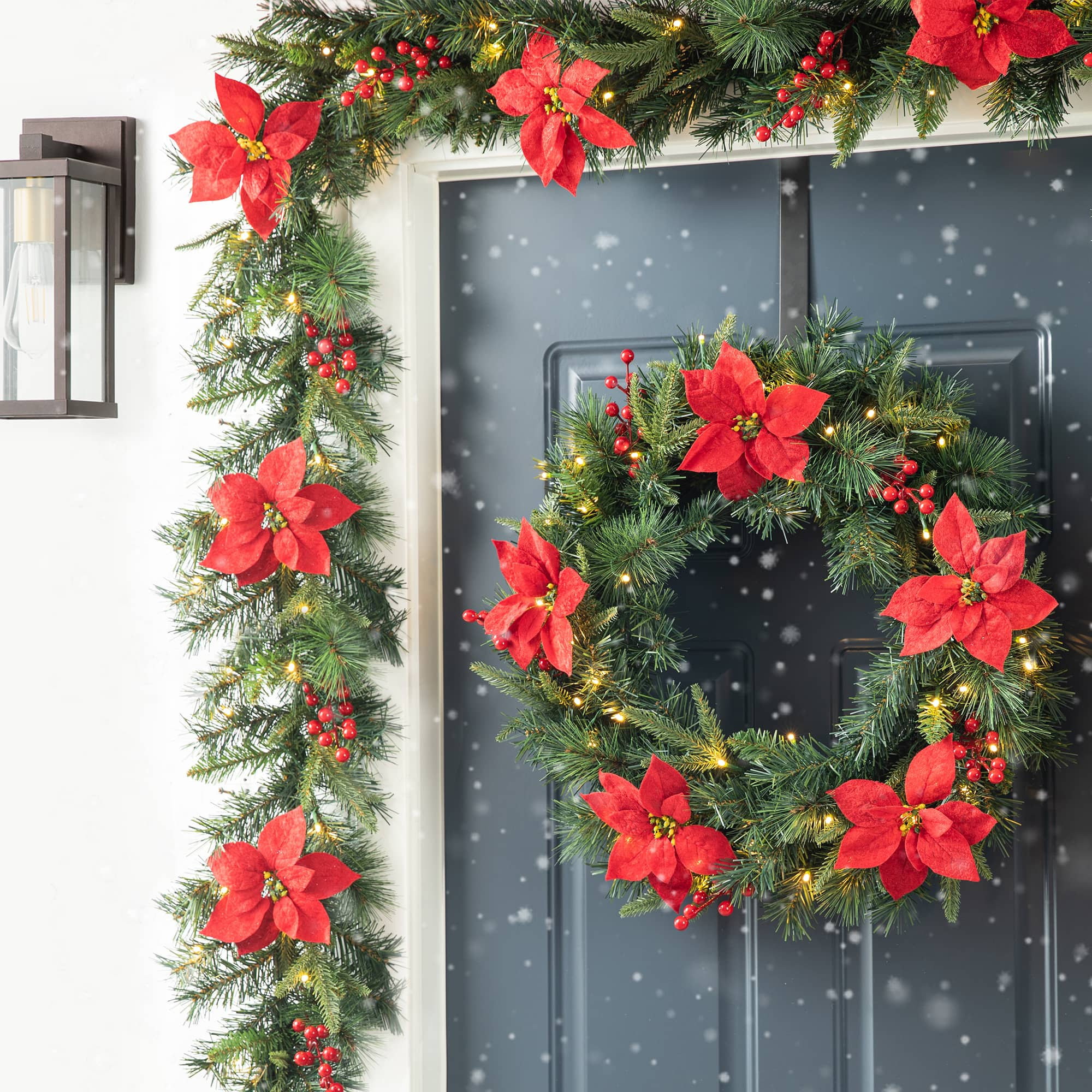 Glitzhome&#xAE; 9ft. Pre-Lit Greenery Pine Poinsettia and Berries Christmas Garland with LED Lights and Timer