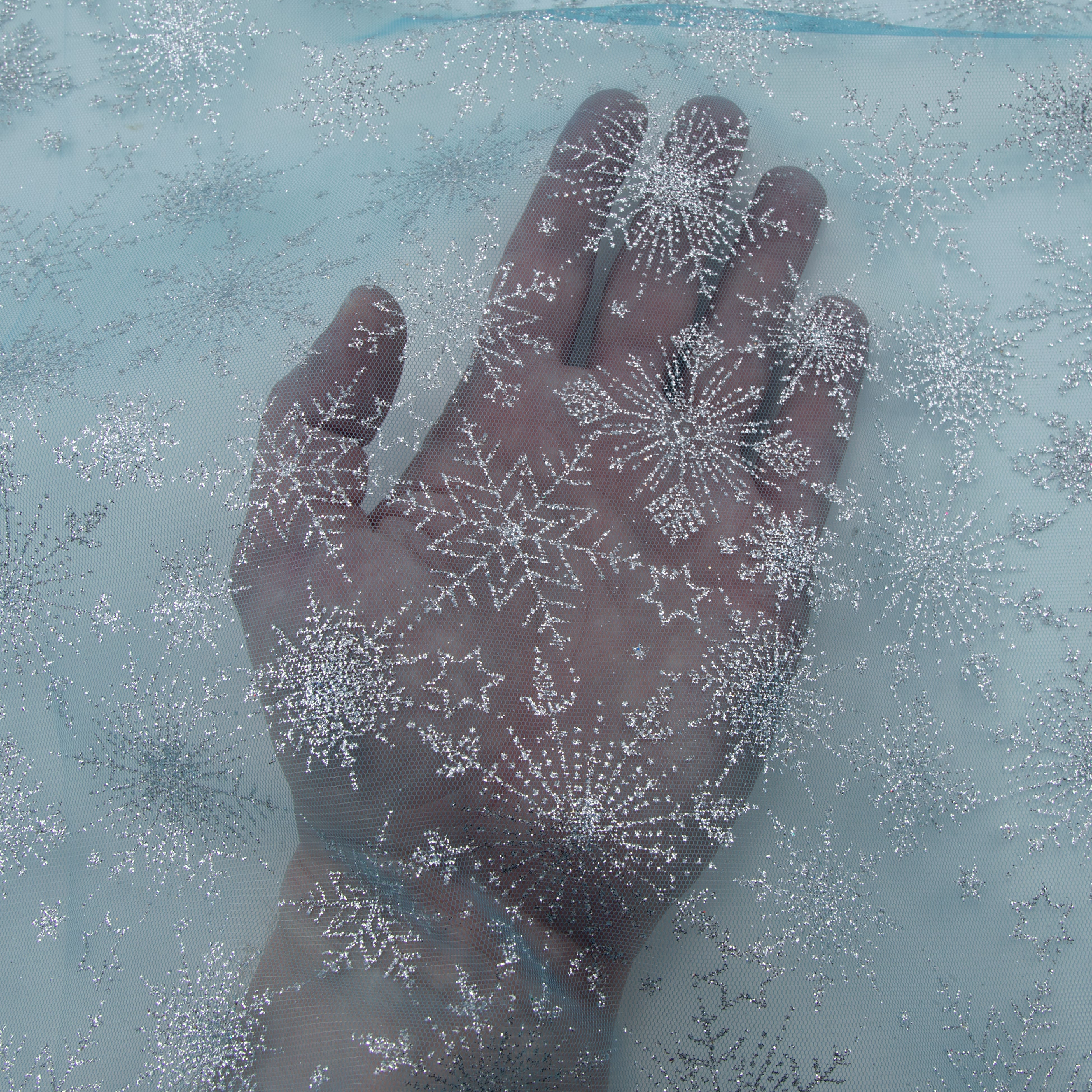 White Glitter Snowflakes on Blue Mesh