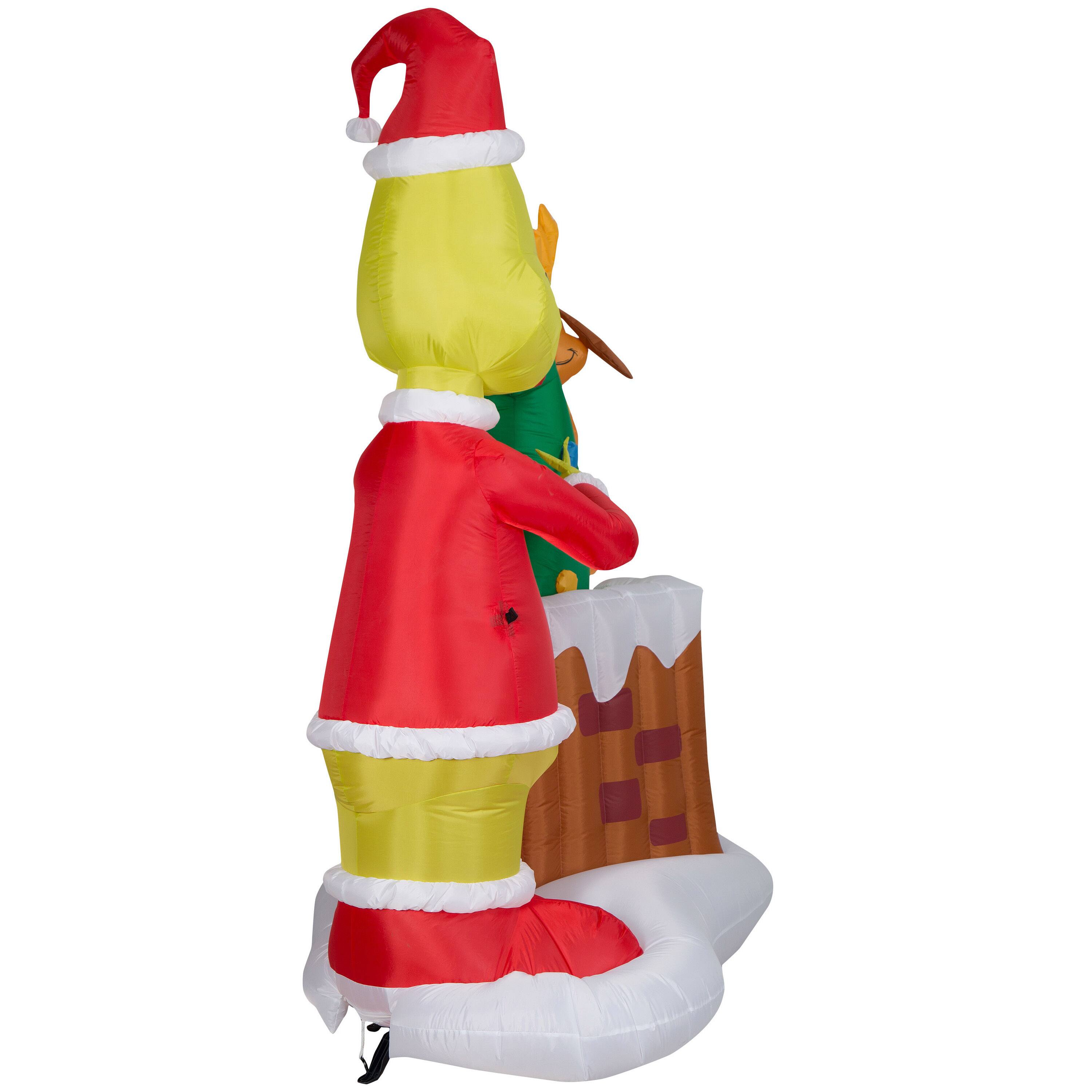 6.5ft. Animated Airblown&#xAE; Inflatable Christmas Grinch Pulling Tree from Chimney