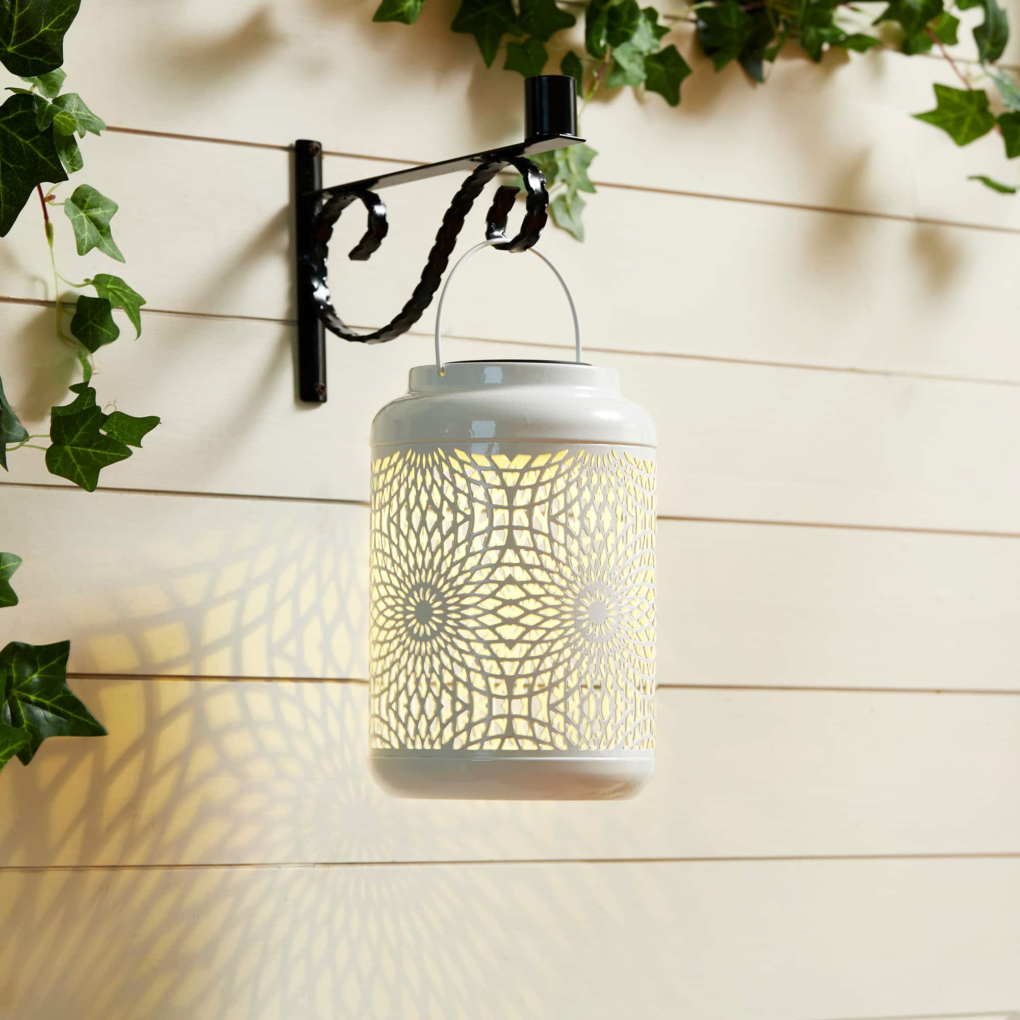Glitzhome&#xAE; 9&#x22; Cutout Metal Solar Powered Outdoor Hanging Lantern