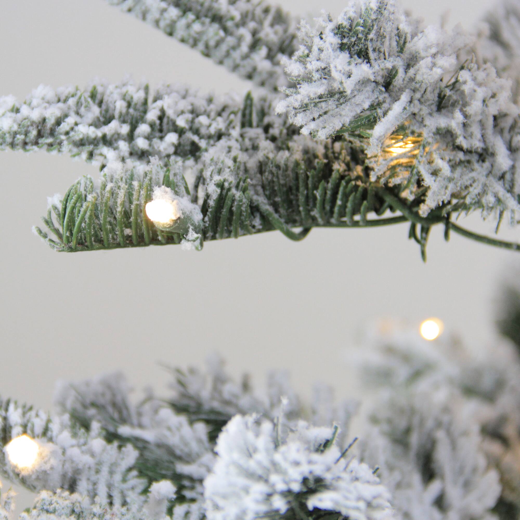 6.5ft. Pre-Lit Flocked Nordmann Fir Artificial Christmas Tree, Warm White LED Lights