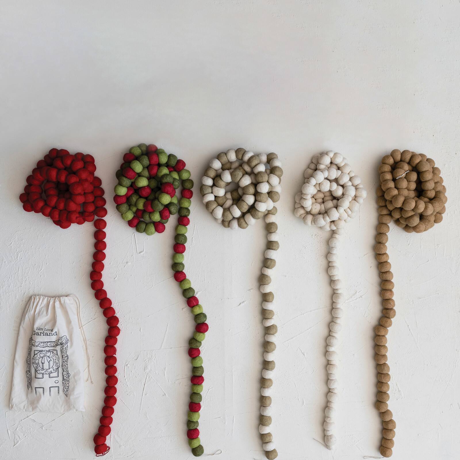 Hello Honey&#xAE; 12ft. Handmade Wool Felt Ball Garland in Printed Drawstring Bag