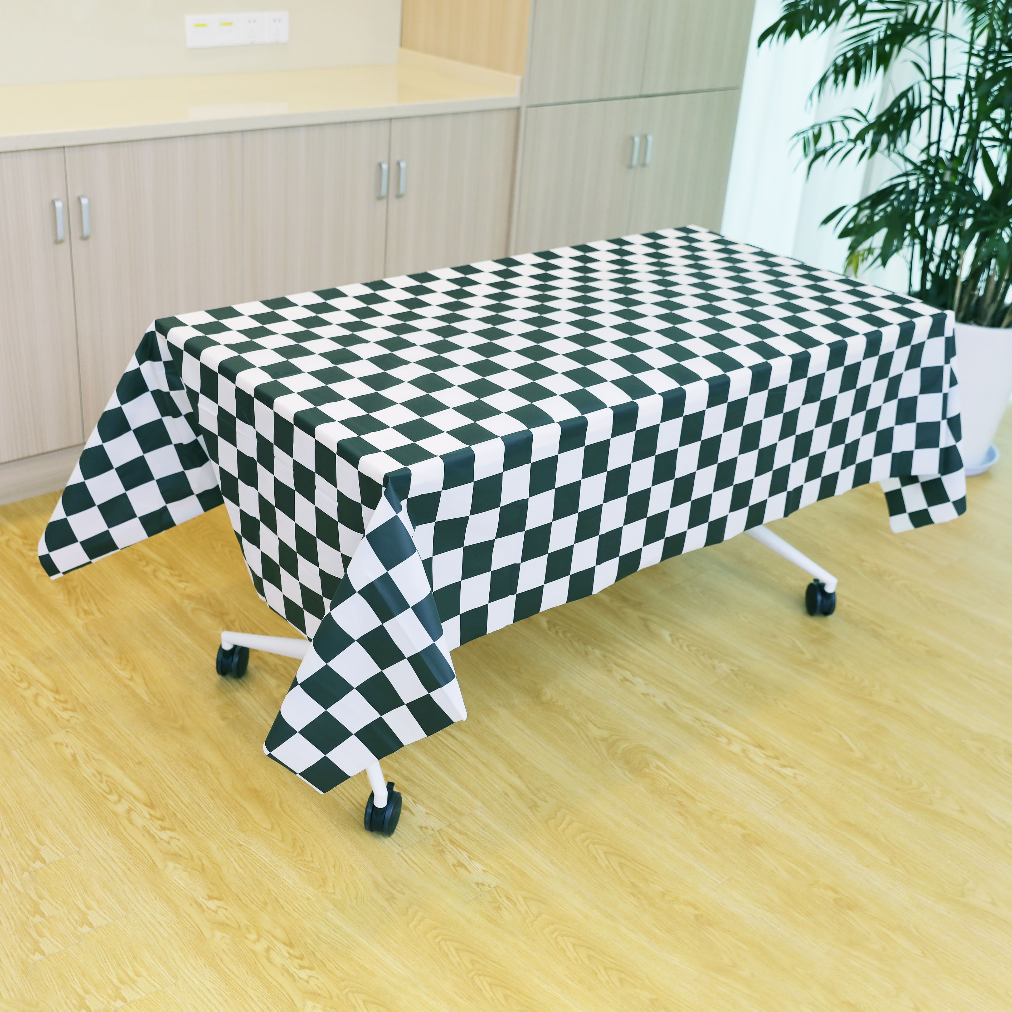 54&#x22; x 108&#x22; Black &#x26; White Checker Plastic Table Cover by Celebrate It&#x2122;