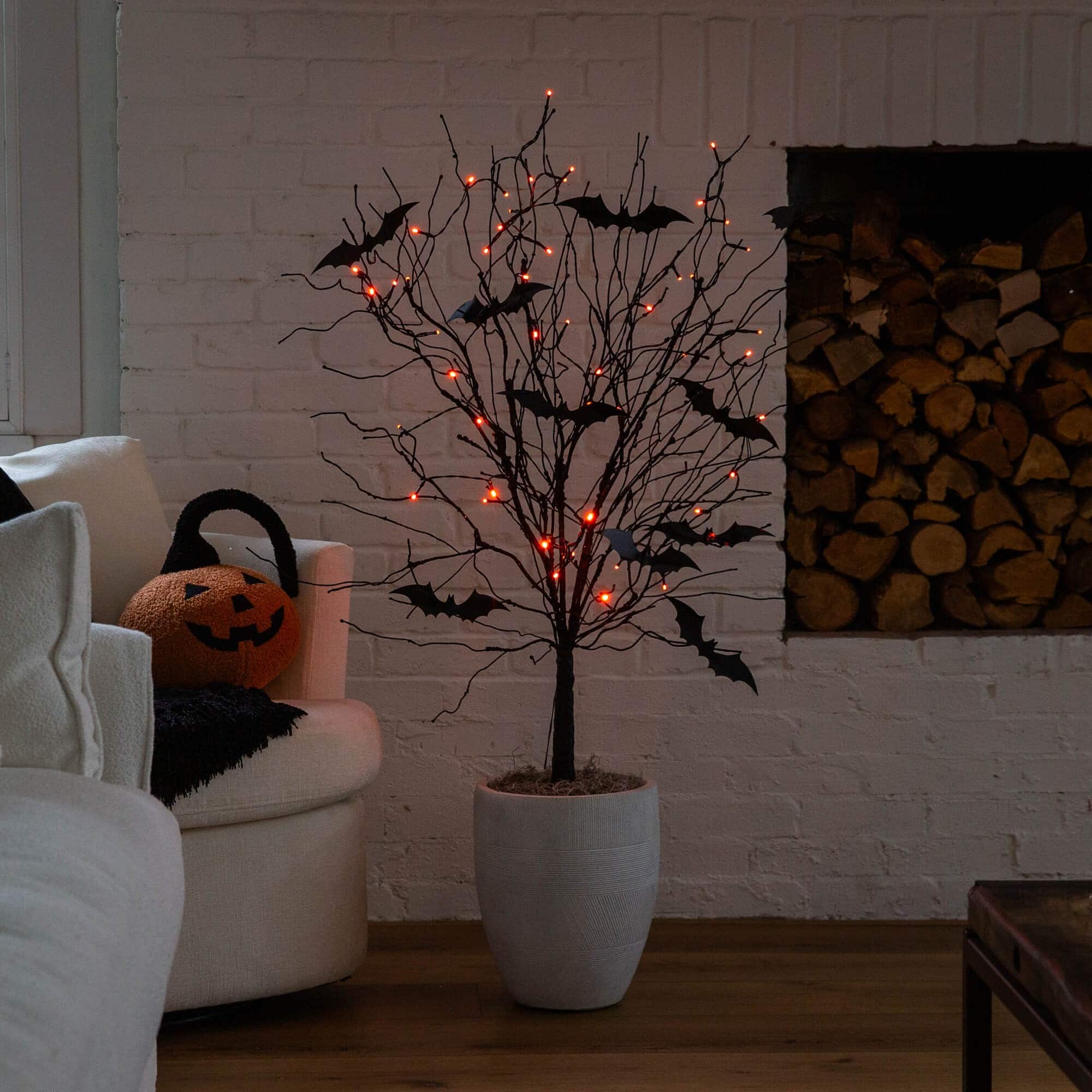 4ft. Pre-Lit Artificial Halloween Black Twig Tree with Bats and 50 Orange LED Lights