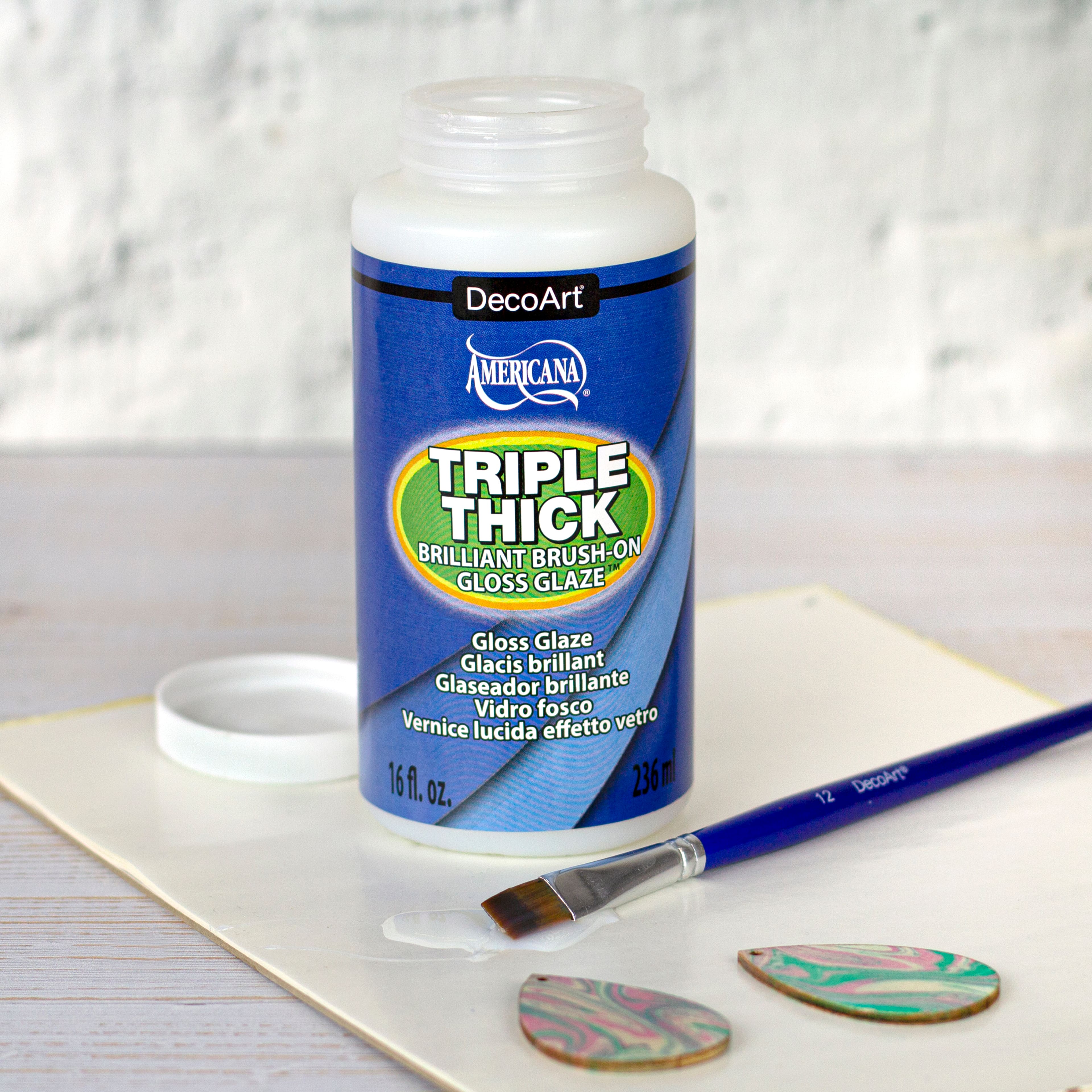 12 Pack: DecoArt® Americana® Triple Thick Brilliant Brush-On Gloss Glaze™, 16oz.