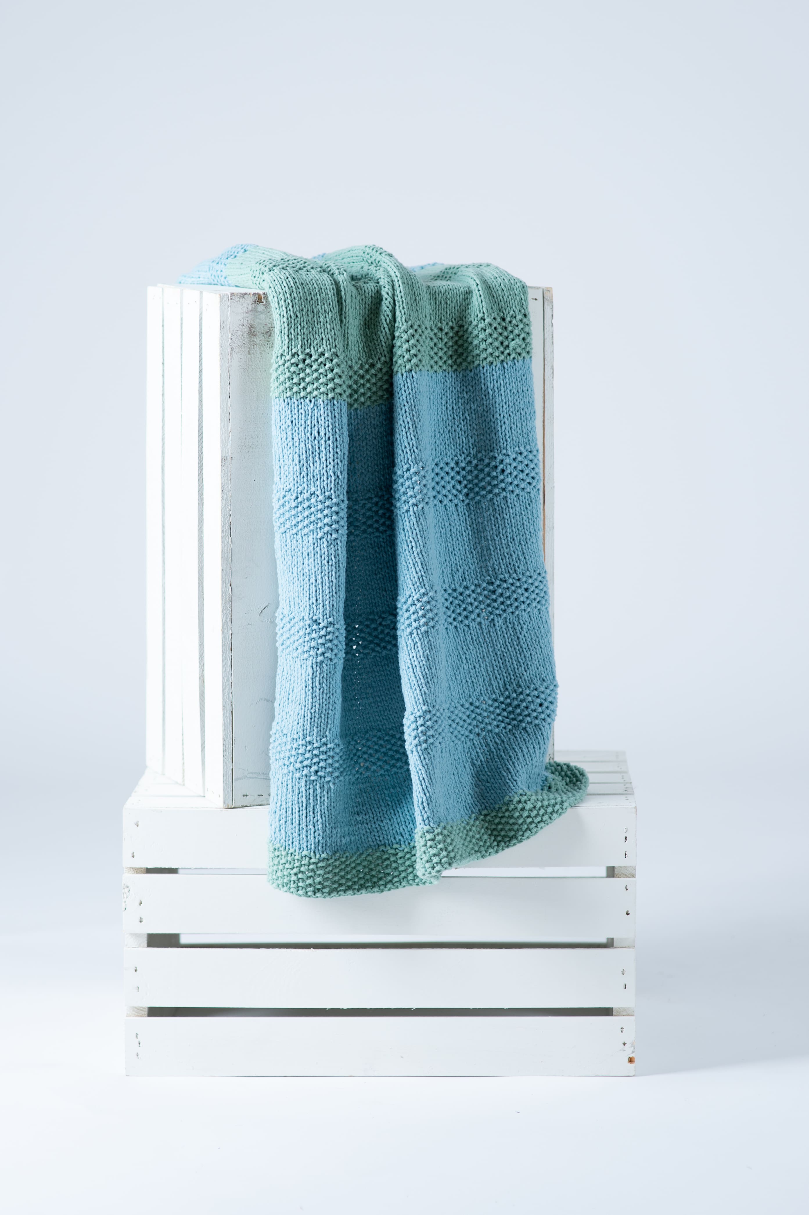 Lion Brand® Feels Like Butta® Bonus Bundle® Two-Tone Knit Stroller Blanket