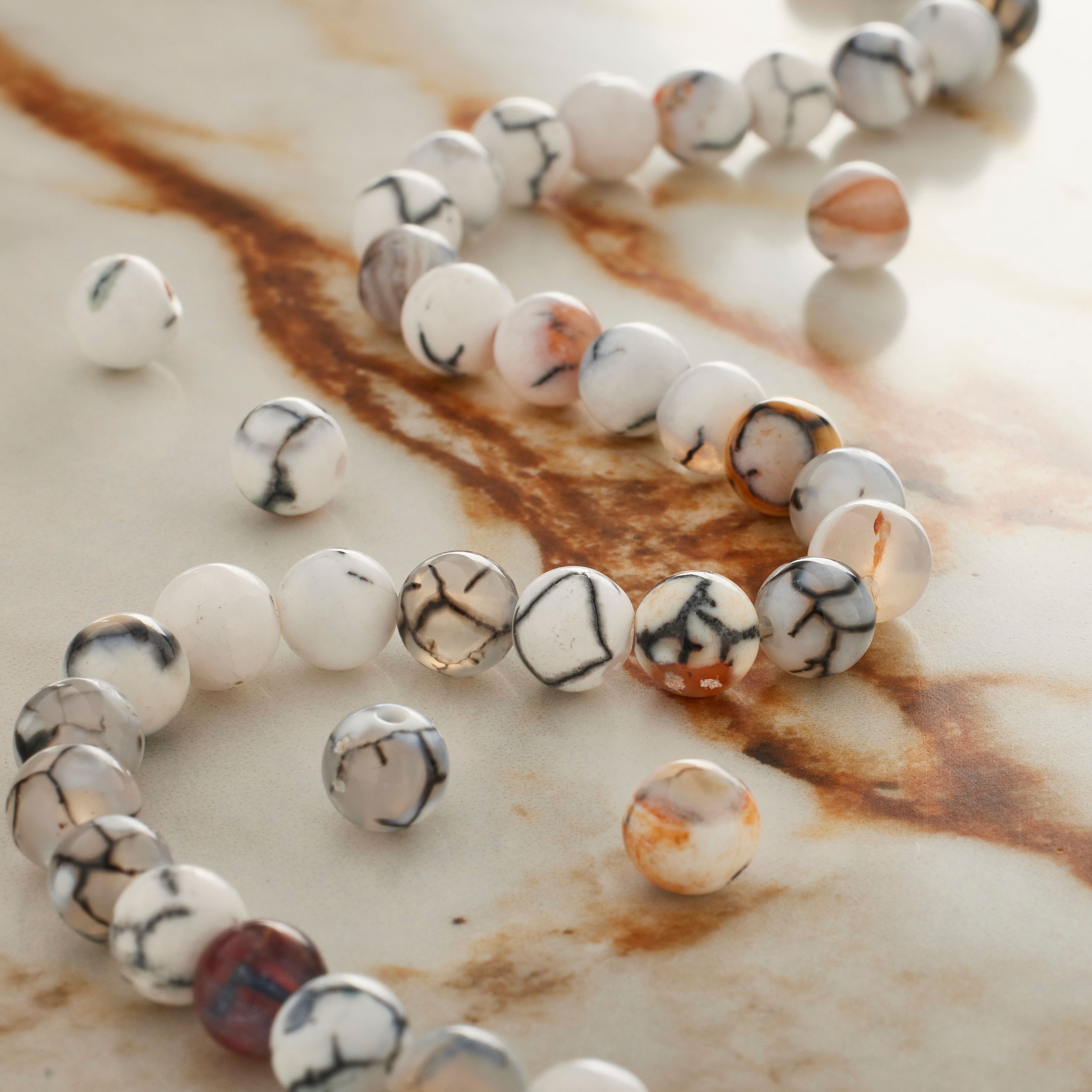 12 Pack: Black & White Fire Agate Round Beads by Bead Landing™