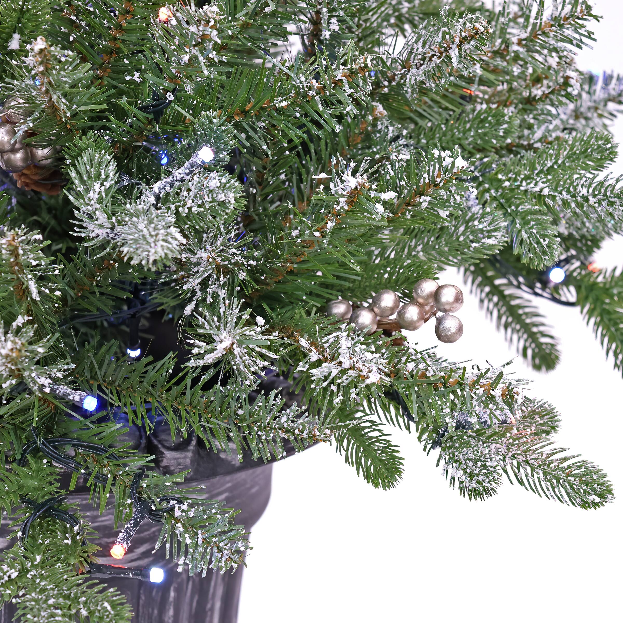 24&#x22; Feel Real&#xAE; Snowy Morgan Spruce Porch Bush in Silver Brushed Plastic Urn with Cones &#x26; Champagne Berries