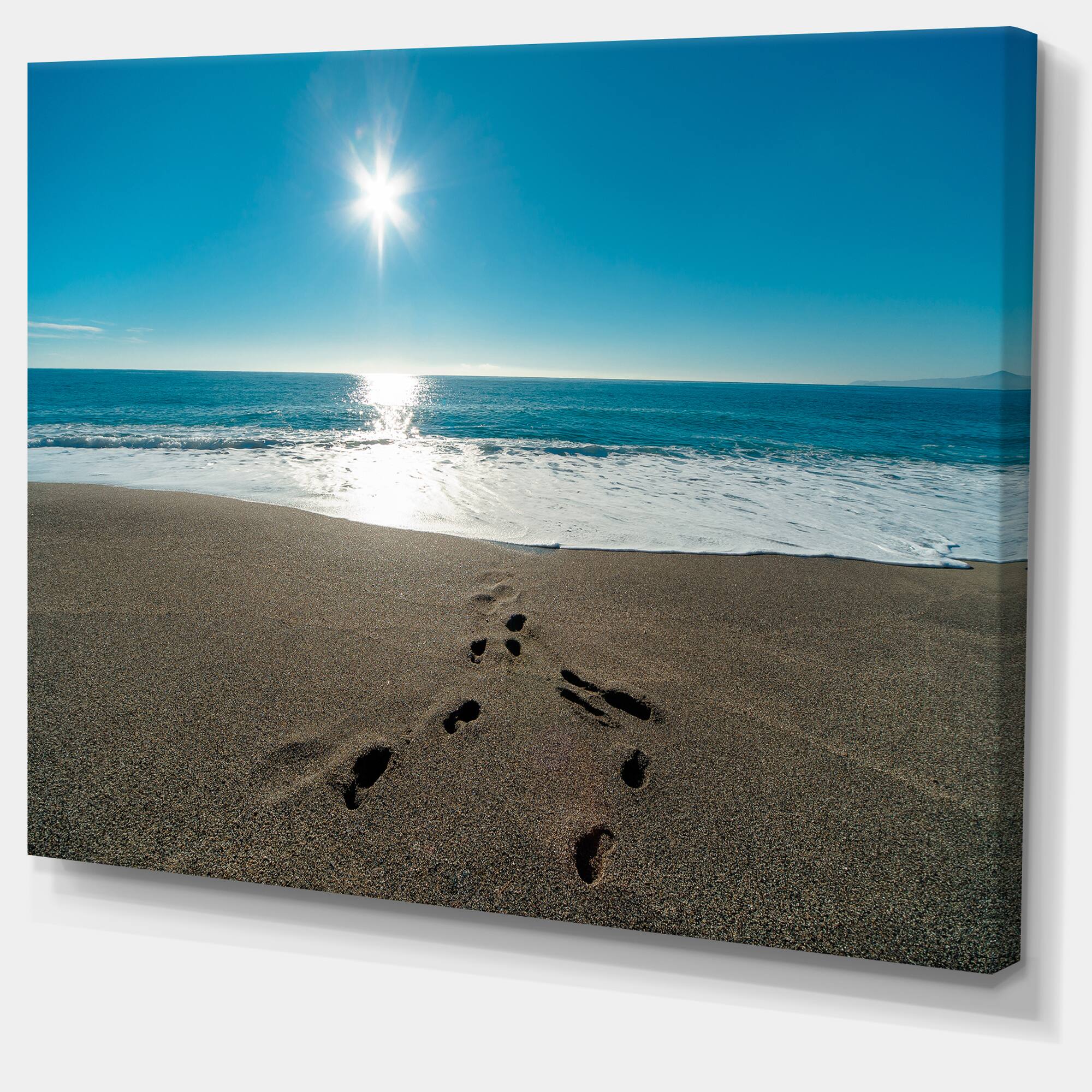 Designart - Blue Sea and Footprints in Sand - Large Seascape Art Canvas Print