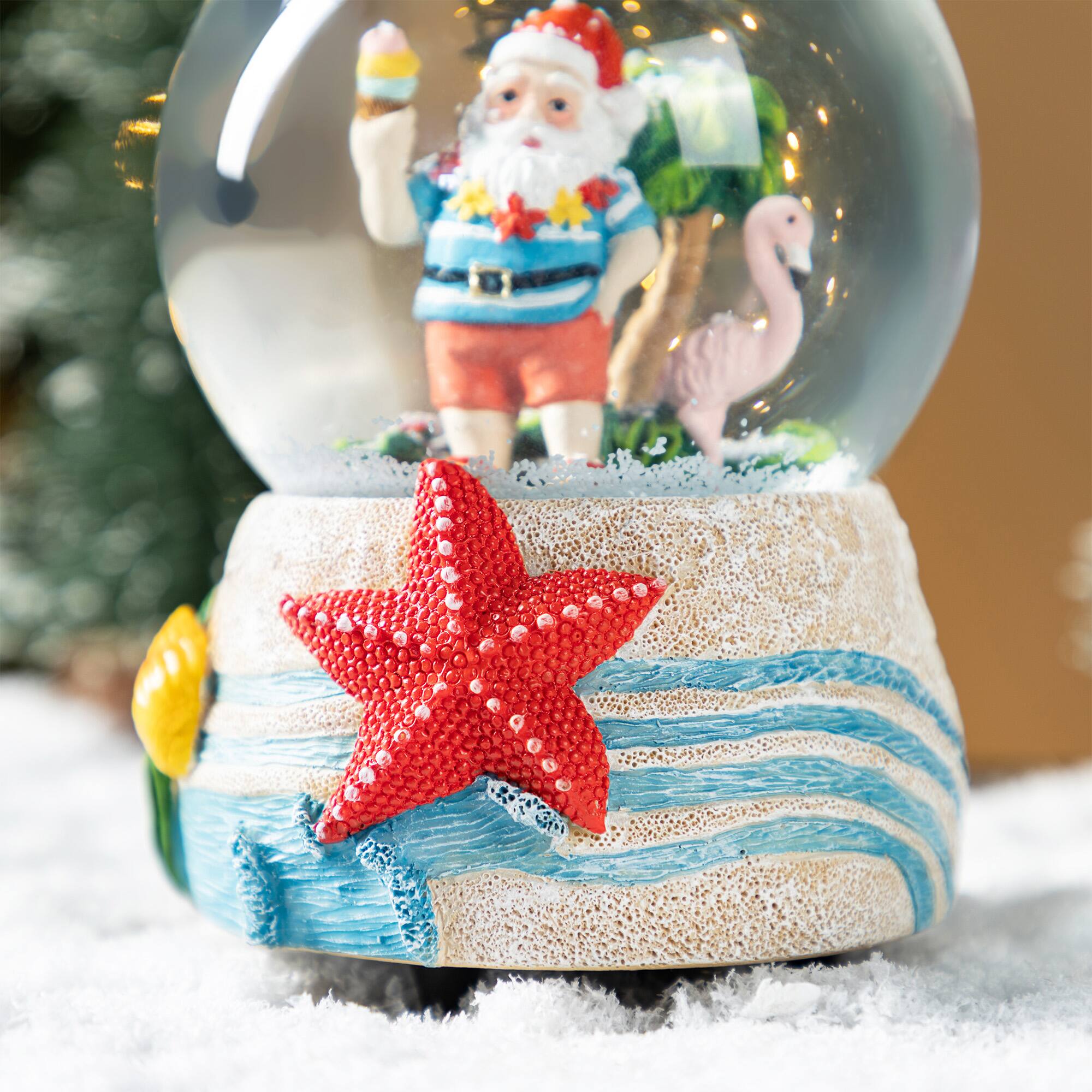 Glitzhome&#xAE; 100mm Christmas Resin Musical Snowflakes Santa on Vacation Waterglobe