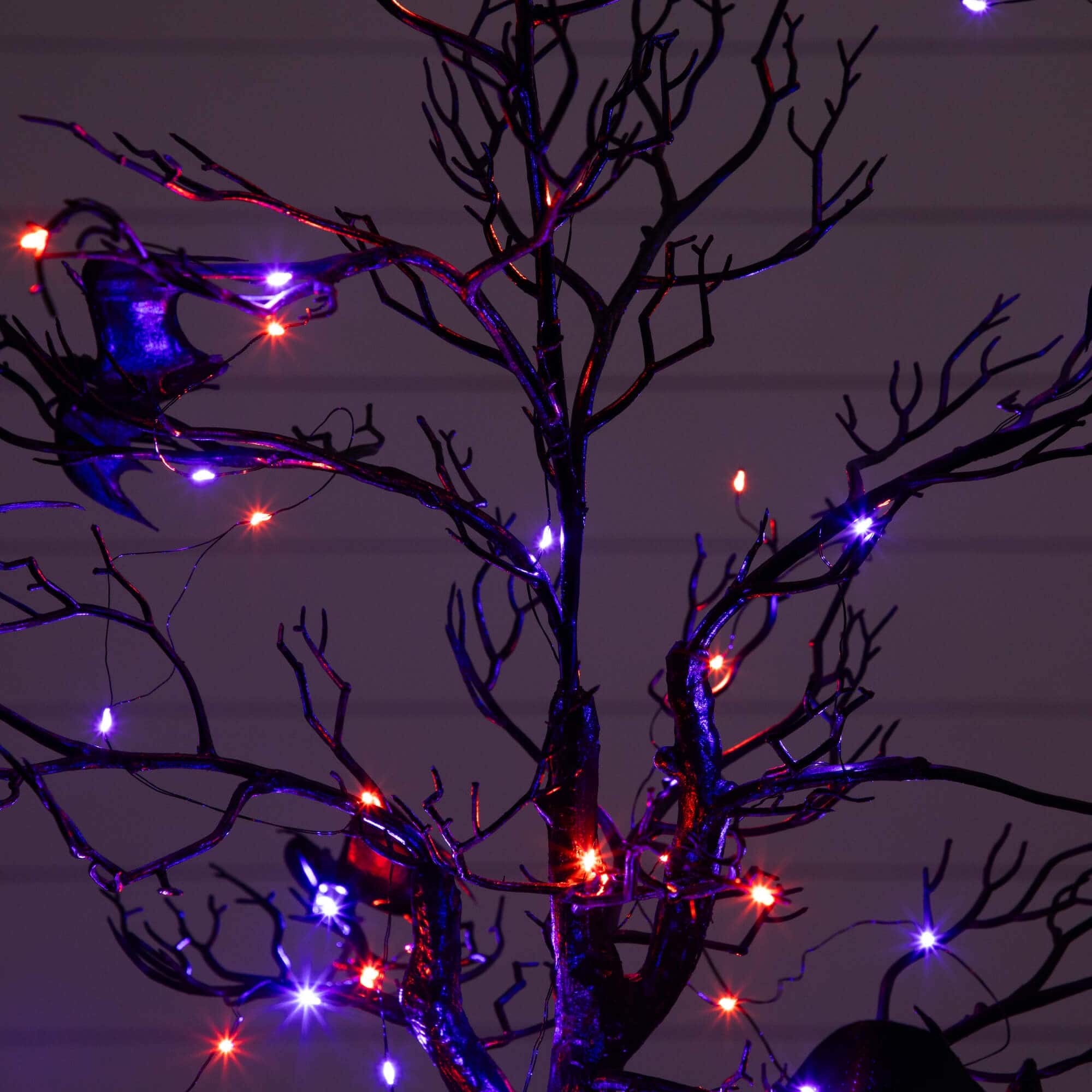 4ft. Pre-Lit Artificial Halloween Black Spooky Twig Tree with Bats and 120 Orange &#x26; Purple LED Lights