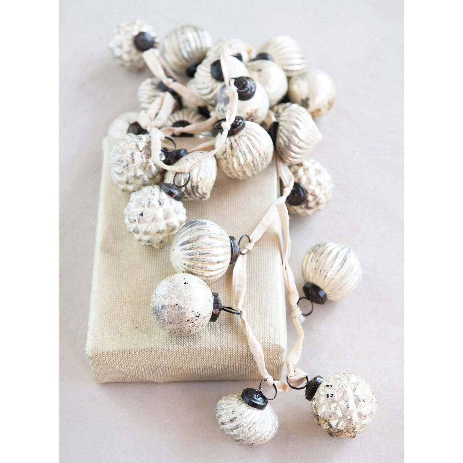 Hello Honey® 6ft. Cream Embossed Mercury Glass Ball Ornament Garland