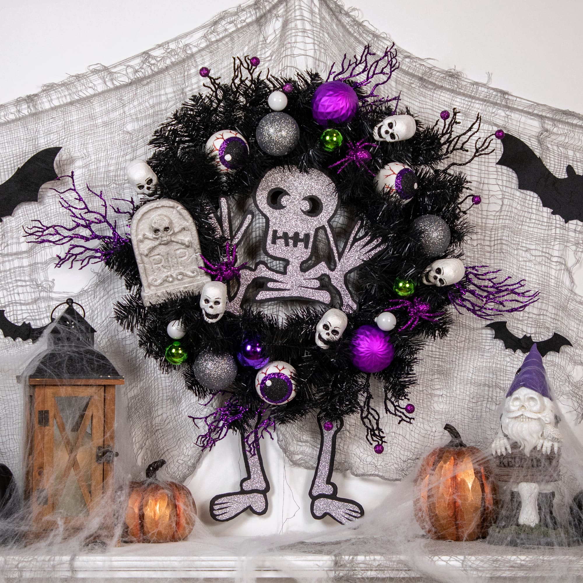 24&#x27;&#x27; Unlit Purple and Black Spooky Skeleton Pine Halloween Wreath