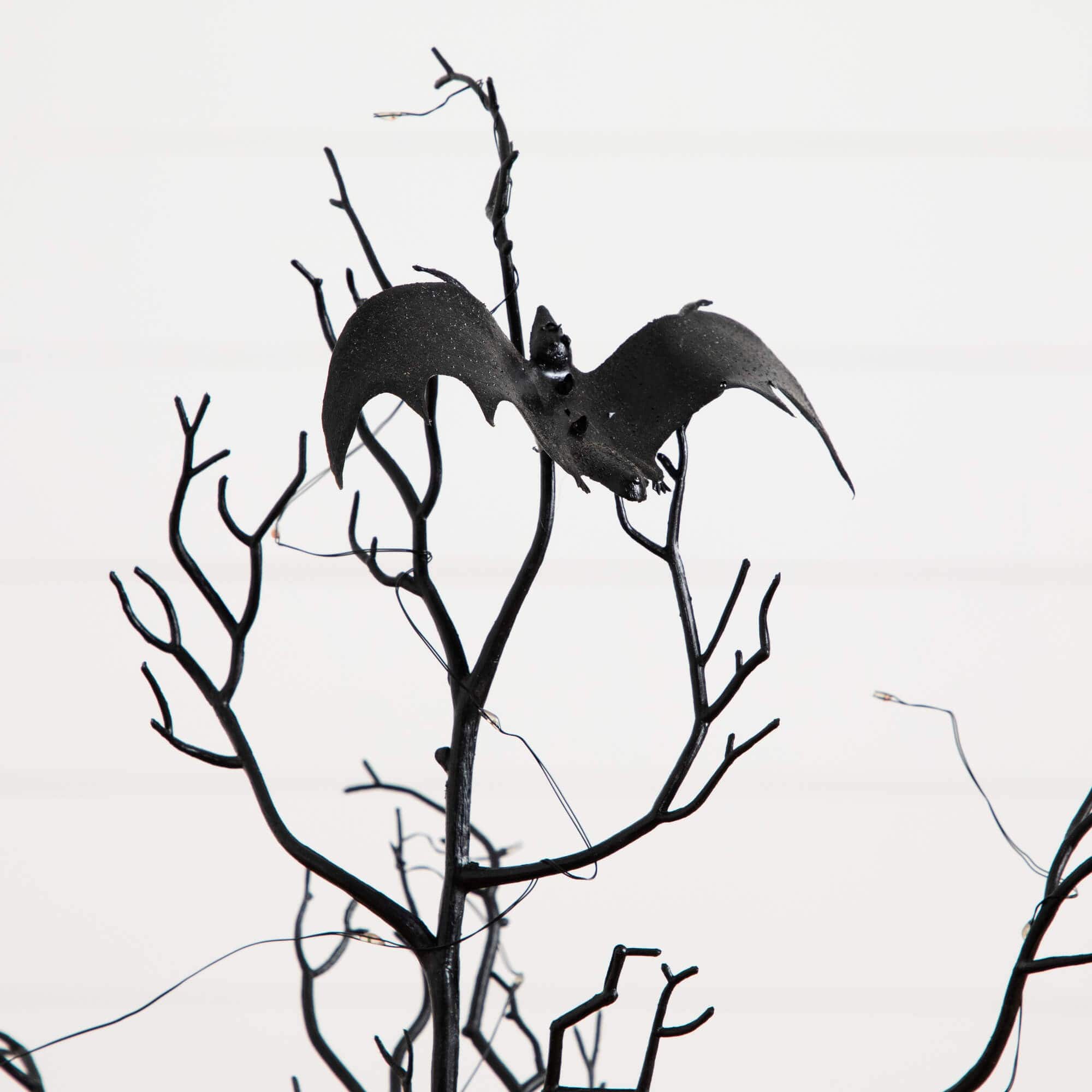 3ft. Pre-Lit Artificial Halloween Black Spooky Twig Tree with Bats and 100 Orange &#x26; Purple LED Lights