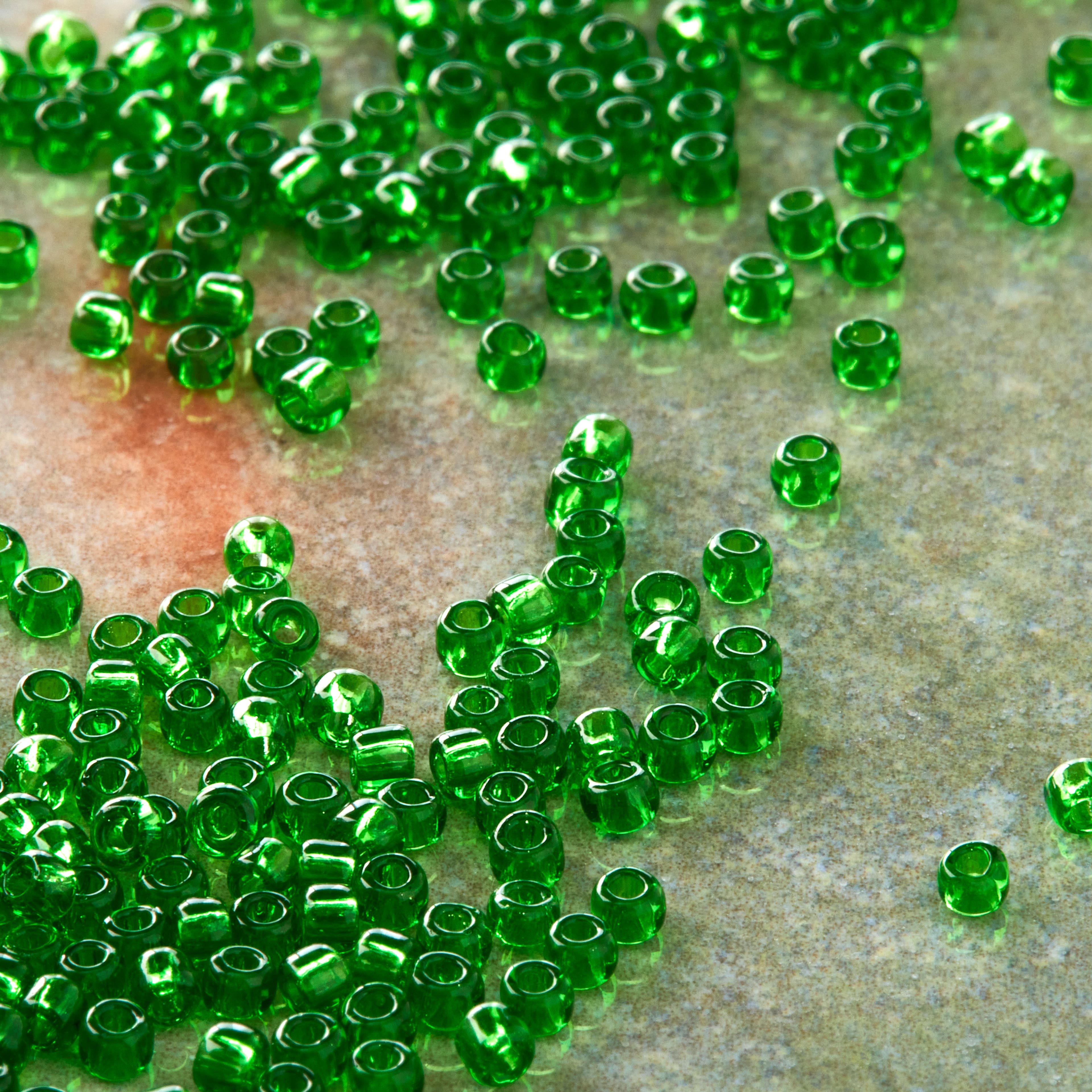 12 Pack: Toho® 11/0 Transparent Green Japanese Glass Seed Beads