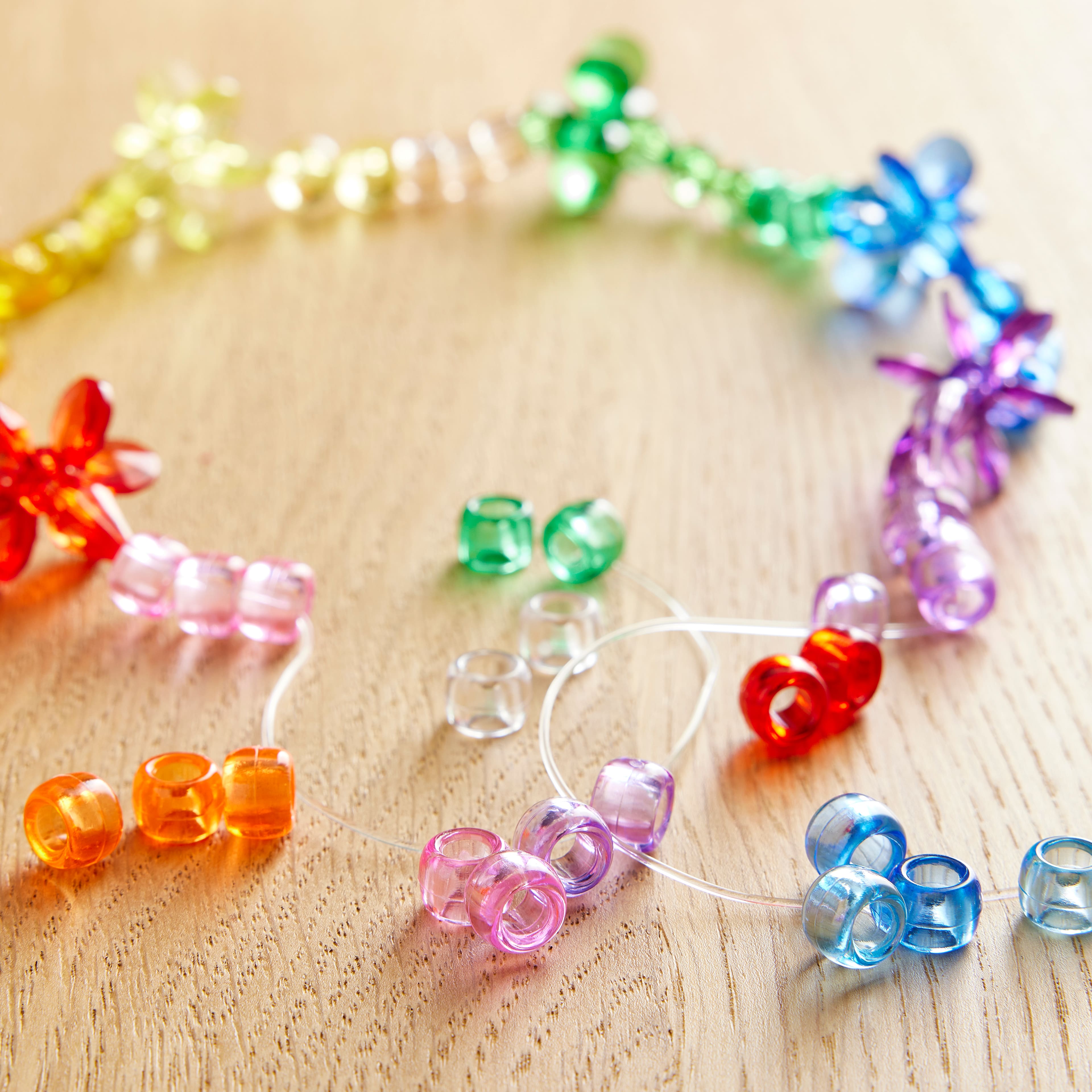 12 Packs: 580 ct. (6,960 total) Multicolor Transparent Pony Beads by Creatology&#x2122;, 6mm x 9mm