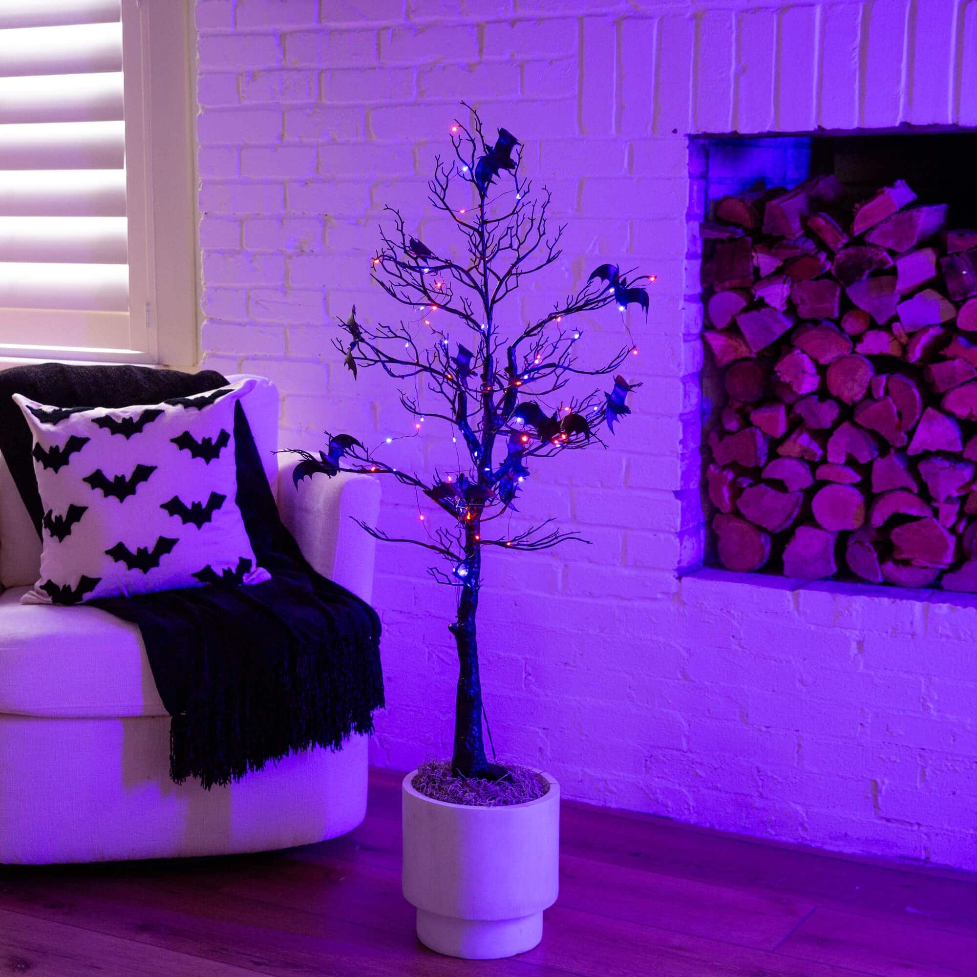 4ft. Pre-Lit Artificial Halloween Black Spooky Twig Tree with Bats and 120 Orange &#x26; Purple LED Lights